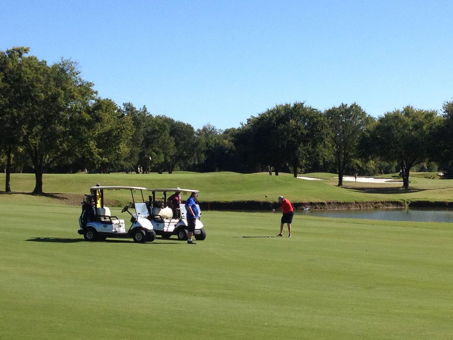 Fairway and green view with water feature on the Lakes Course