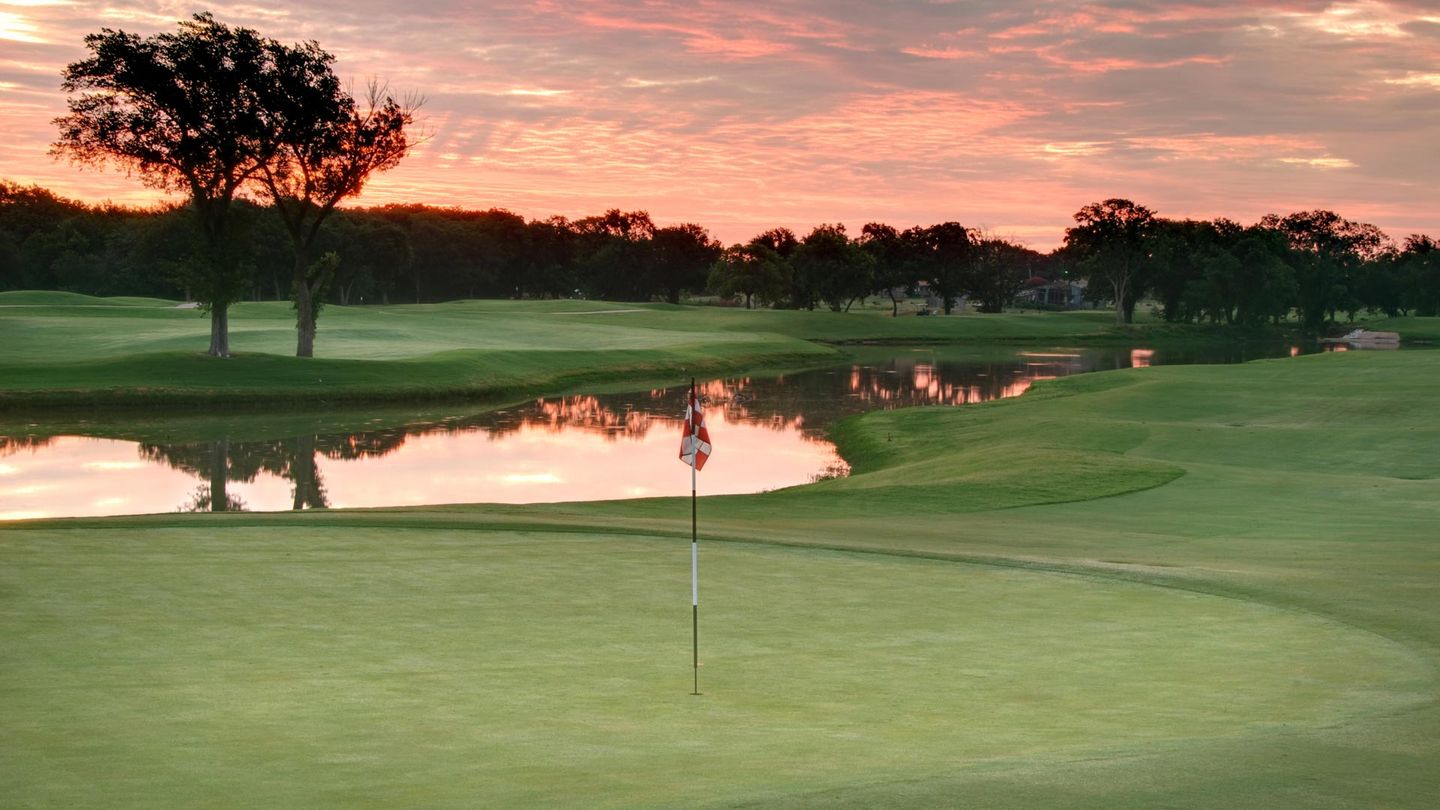 Aerial view of fairway with water hazards and trees