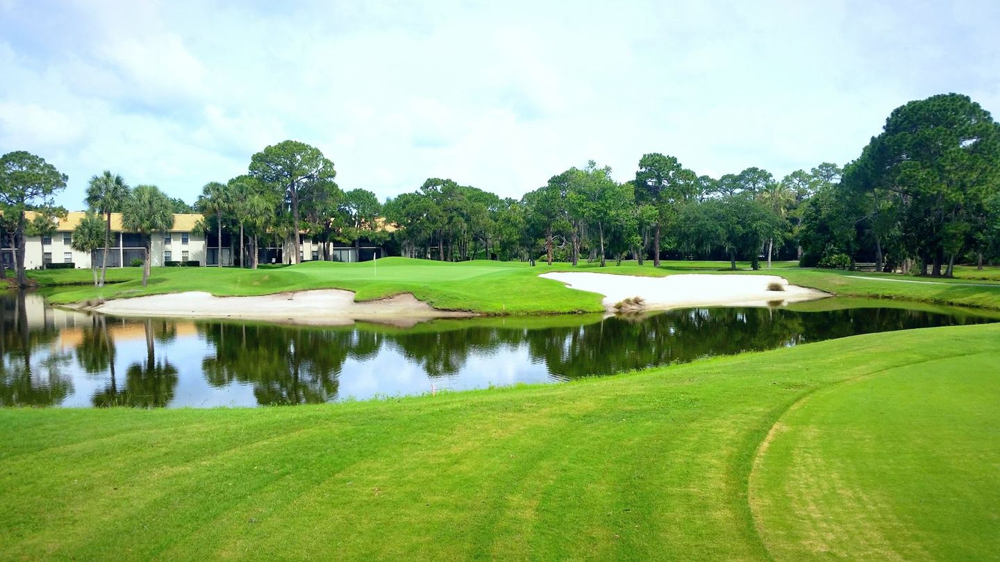 Golf green, bunkers and water at The Meadows golf community in Sarasota.