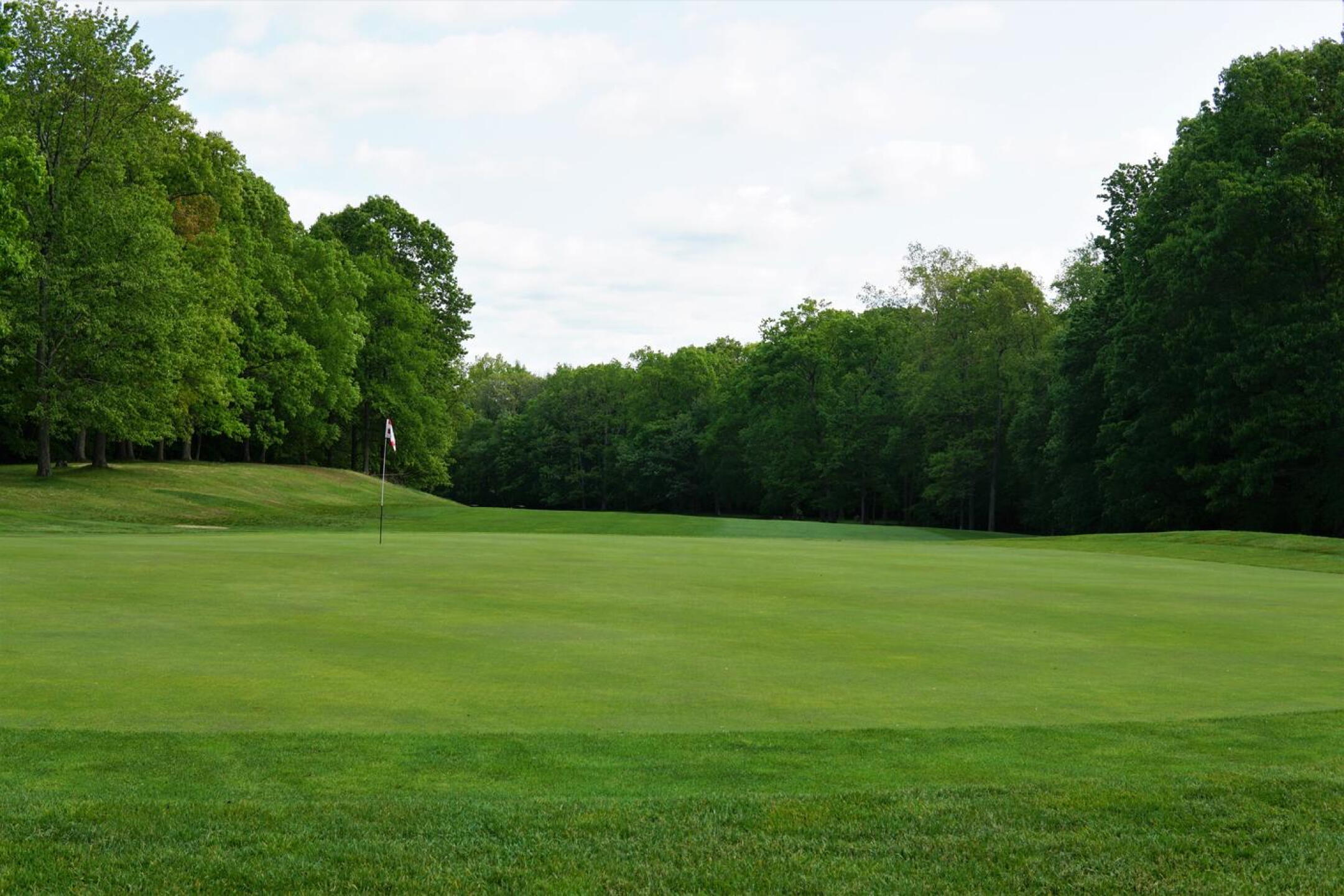 The par-4 fifth hole doglegs right and plays uphill to this enormous green, tilted strongly from back to front. (Photo submitted by AptlyLinked on 05/22/2023)