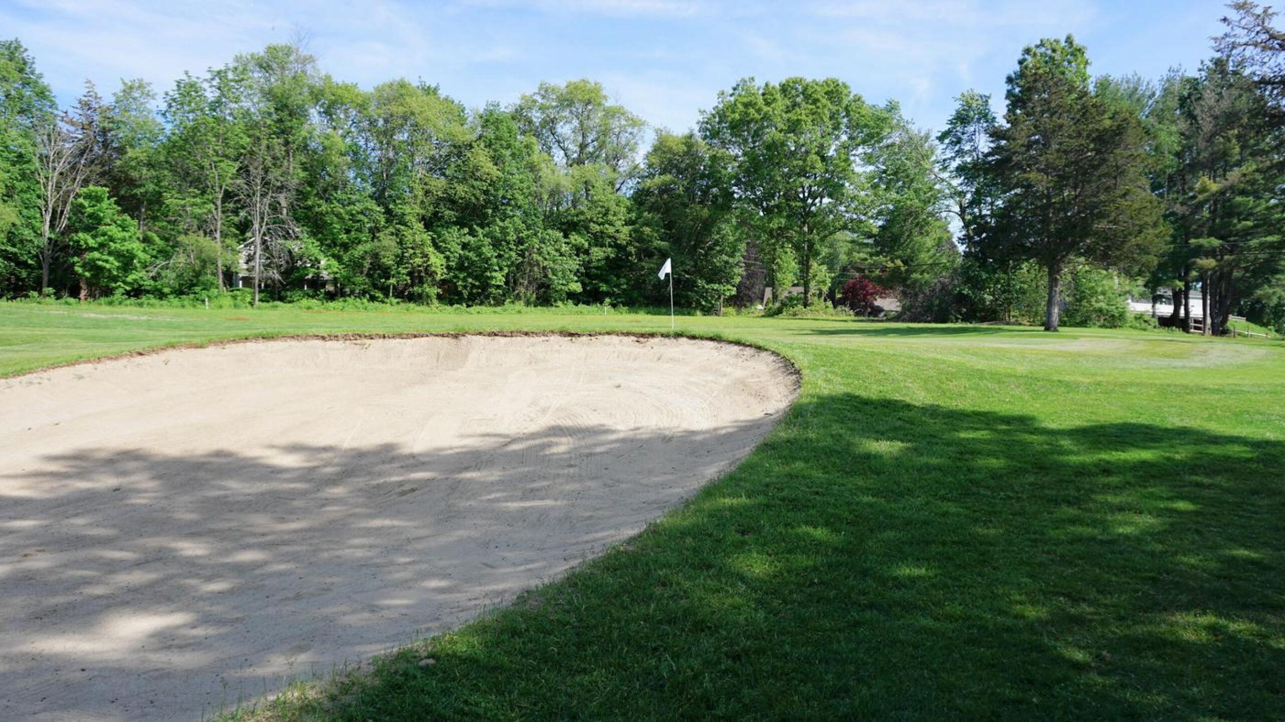 Nine: The heavily rolling fairway leads to this green, but not (you’ll hope) this bunker. (Photo submitted by AptlyLinked on 05/26/2021)