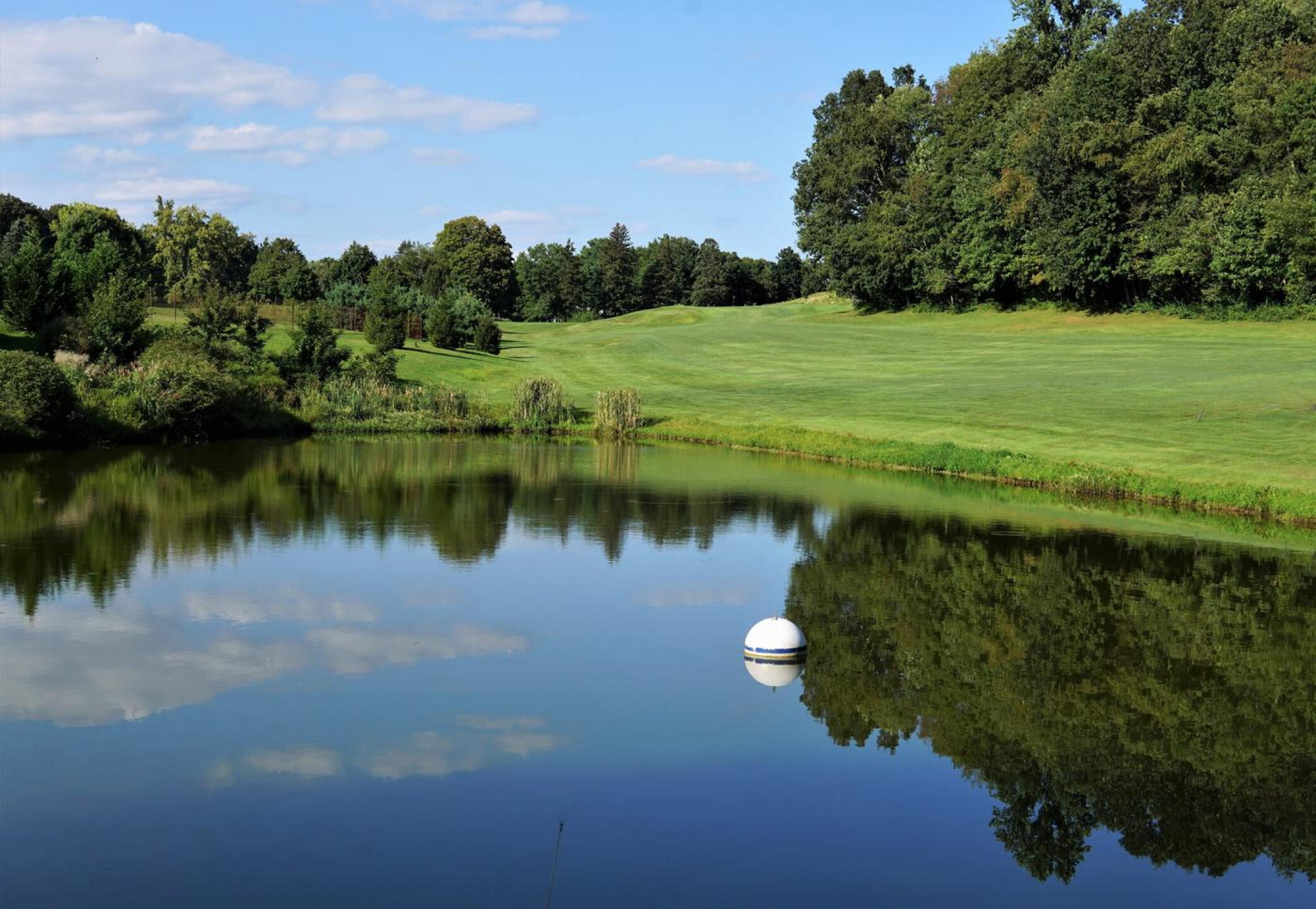 A large pond, which lines part of the eighth fairway, looks serene on a late summer’s afternoon. (Photo submitted by AptlyLinked on 09/06/2023)