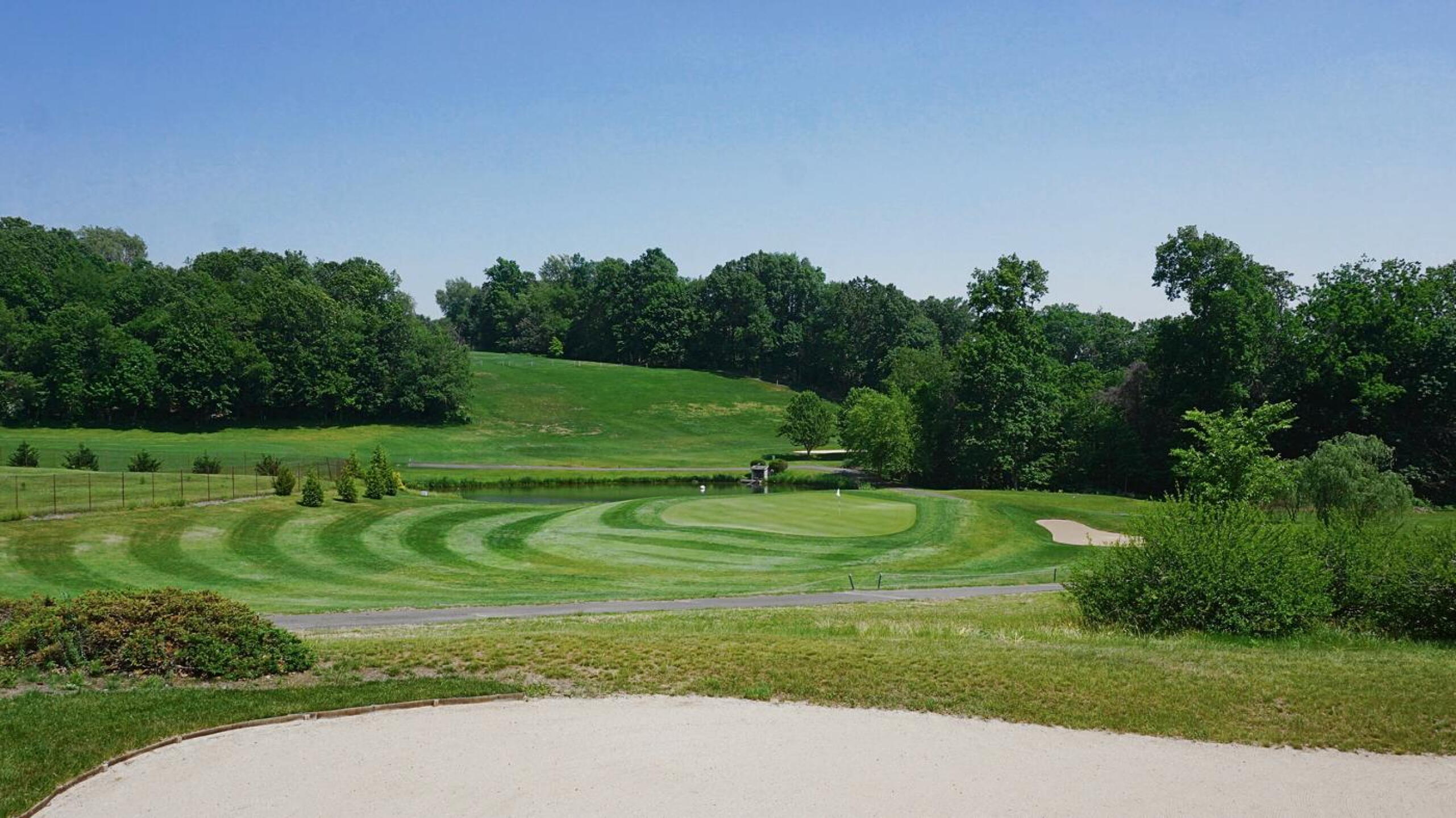 Seven. View downhill to its green, looking over a bunker on the sixth. (Photo submitted by AptlyLinked on 06/25/2021)