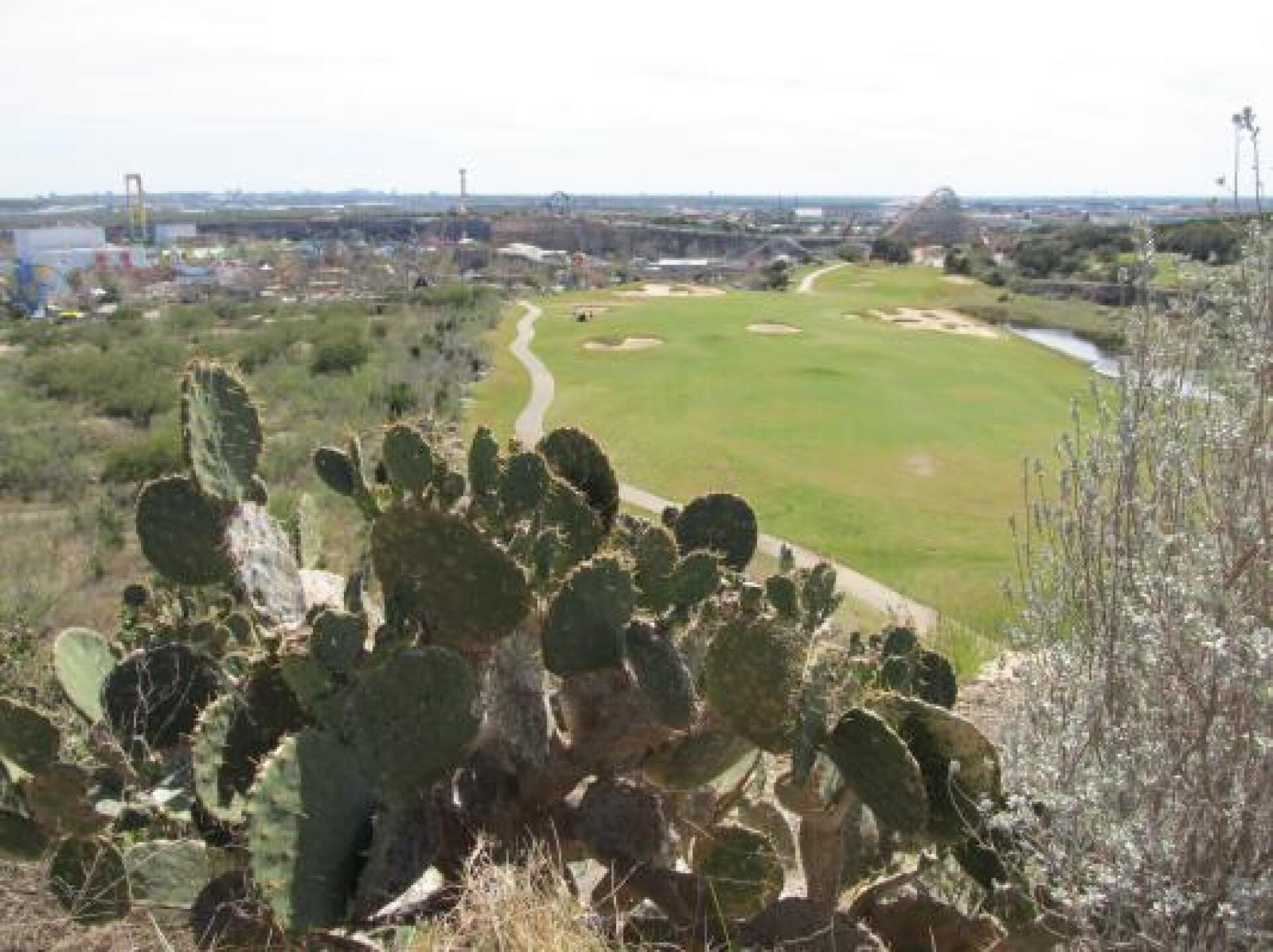 La Cantera Resort Course Hole #7 from the tee with Fiesta Texas behind the hole (Photo submitted by bobandrews on 02/26/2013)