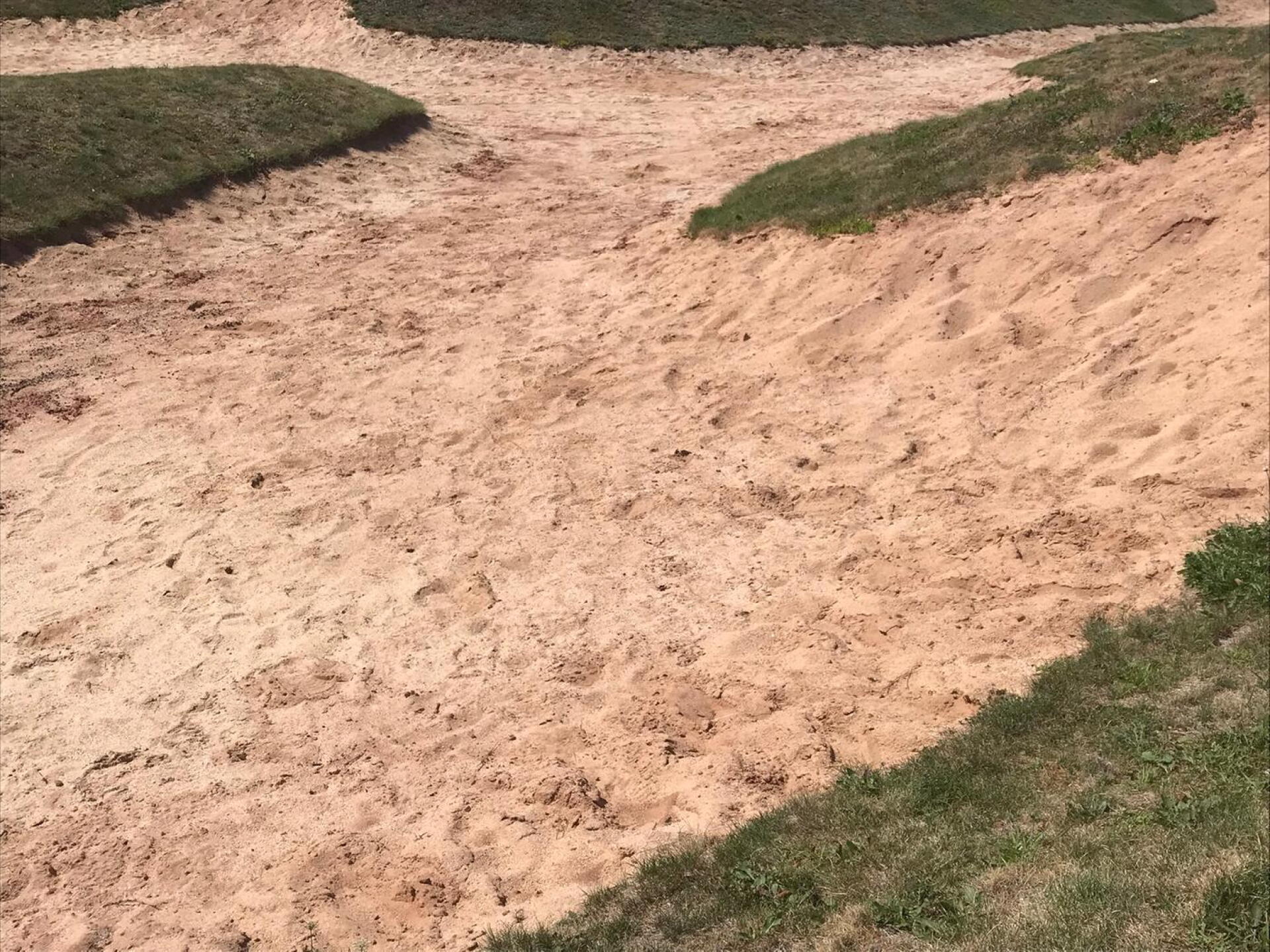 Typical bunker...none raked and some even had cart tracks through them....a big mess. (Photo submitted by Cofgh7ks1rPJFSKR13p6 on 08/20/2020)