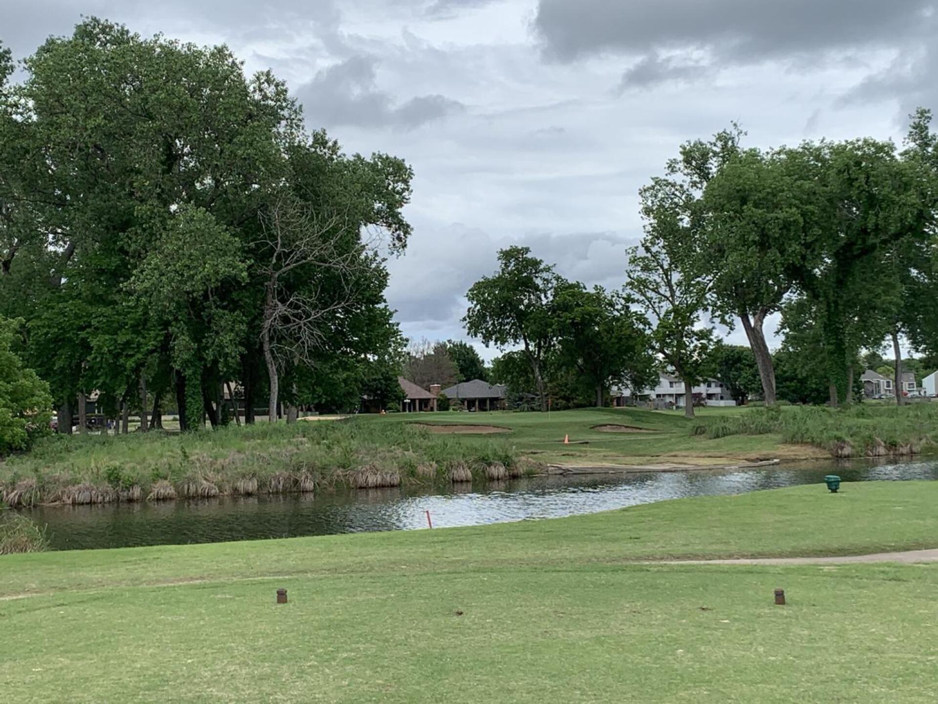 Hole 16. Medium-long par 3 over water and through a tight tree opening (Photo submitted by Alex326 on 05/21/2021)