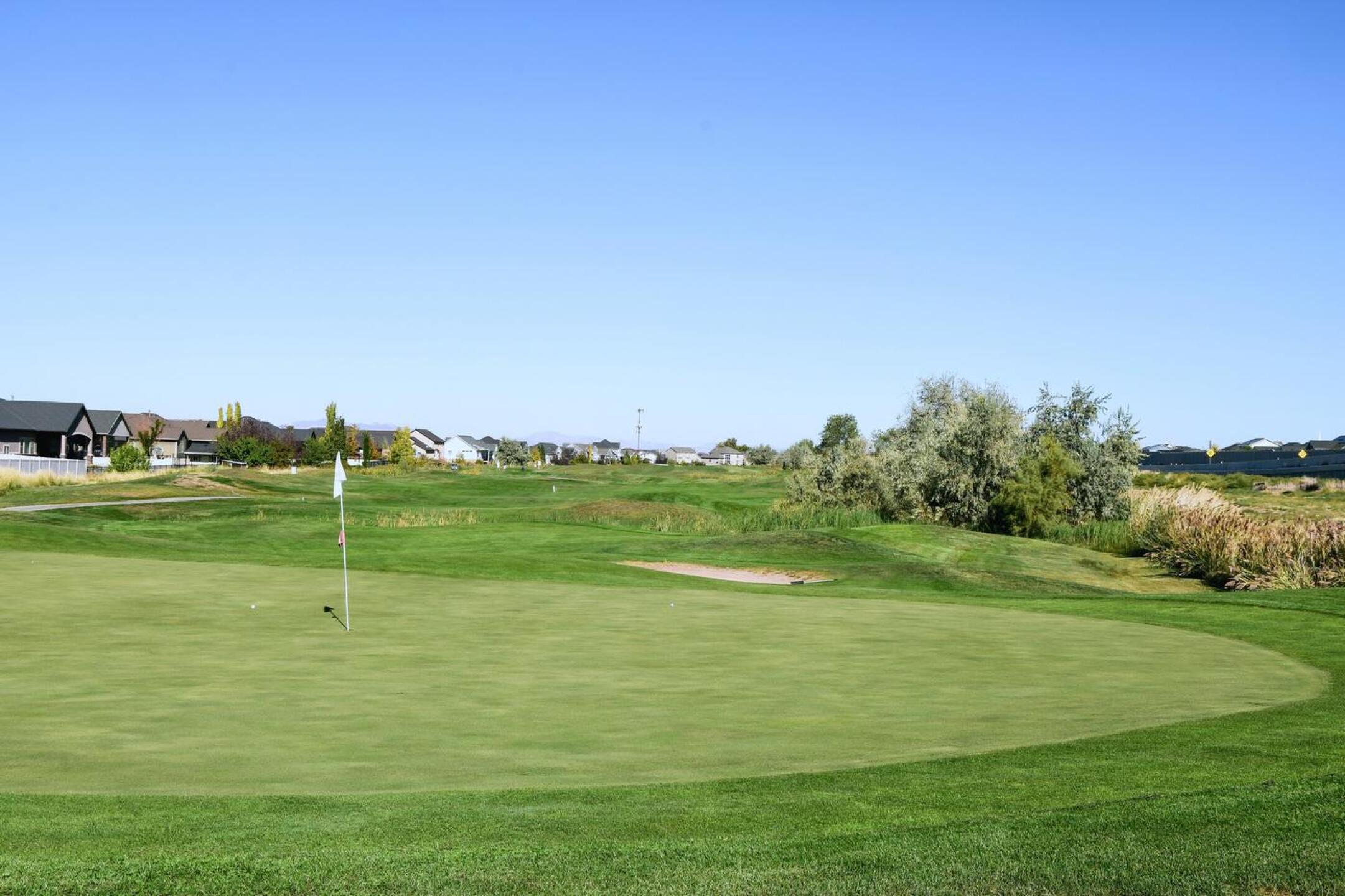 Two bunkers guard the par-4 seventeenth green, one in front and another (out of view) in back. Only 370 yards, this hole is still among the best and most strategic at Glen Eagle. (Photo submitted by AptlyLinked on 10/07/2025)
