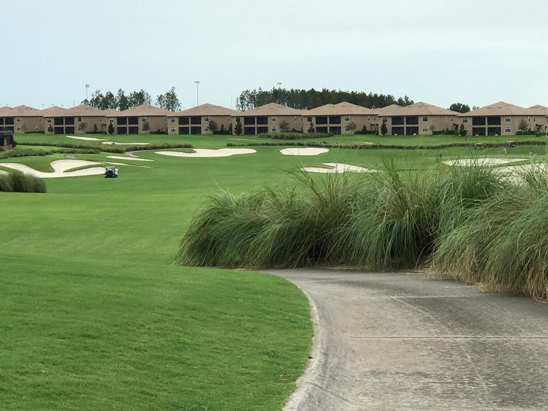 Cookie cutter town homes serve as the backdrop for the par five 18th hole (Photo submitted by jorruss on 07/31/2017)
