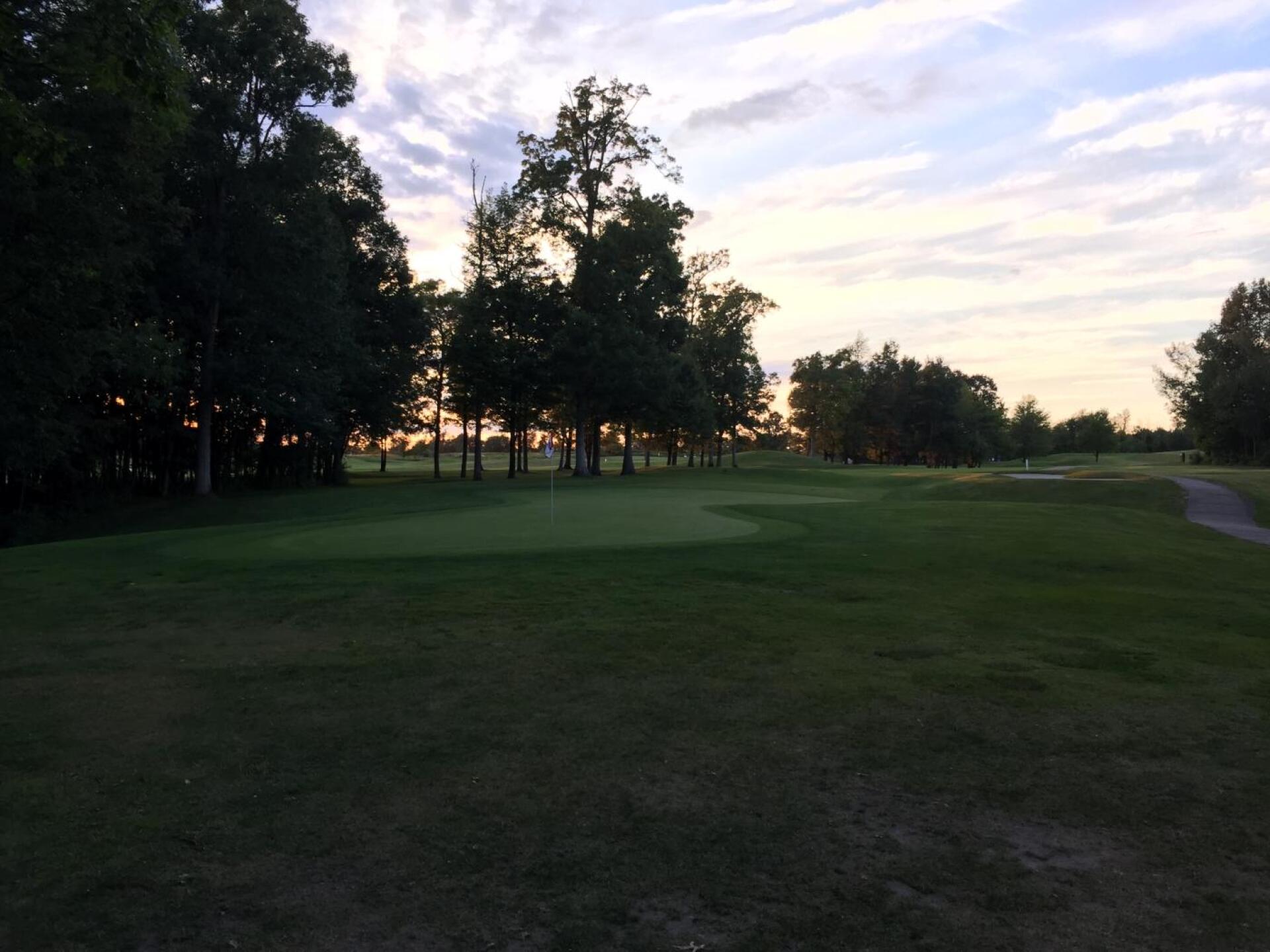 Sunset view of 13th green.  Hardest, longest hole in the golf course.  Green is deep, look where the pin is (Photo submitted by BuffaloBen15 on 08/25/2019)
