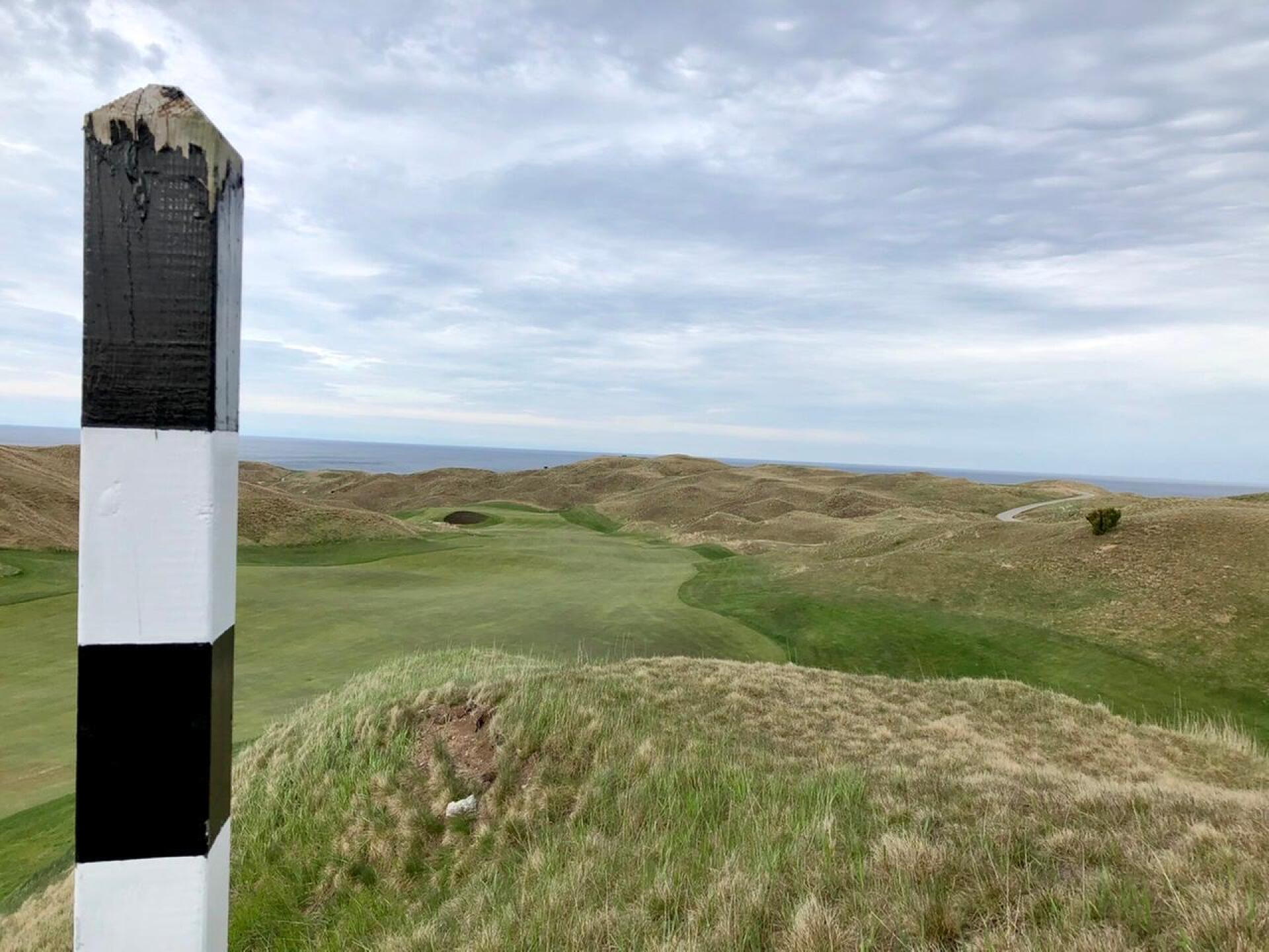 The aiming pole for the semi-blind tee shot on the par-4 10th (Photo submitted by BrandonWebb on 05/21/2020)