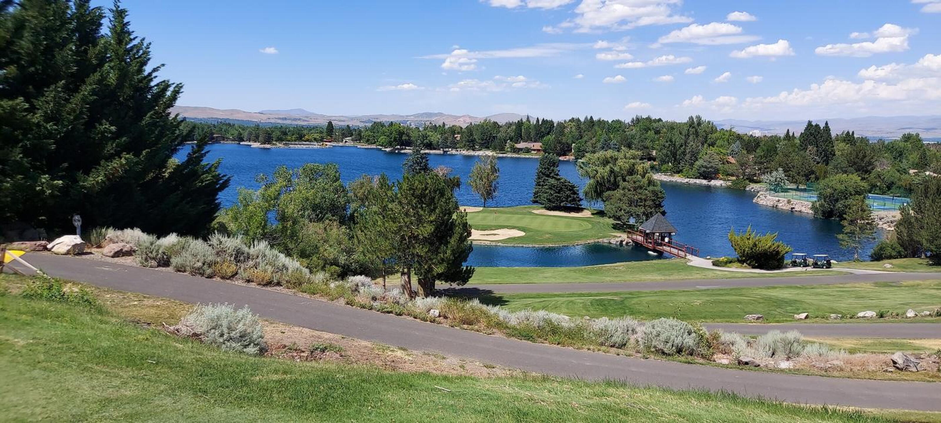 Beautiful signature hole #15 (Photo submitted by alwolff on 07/20/2023)