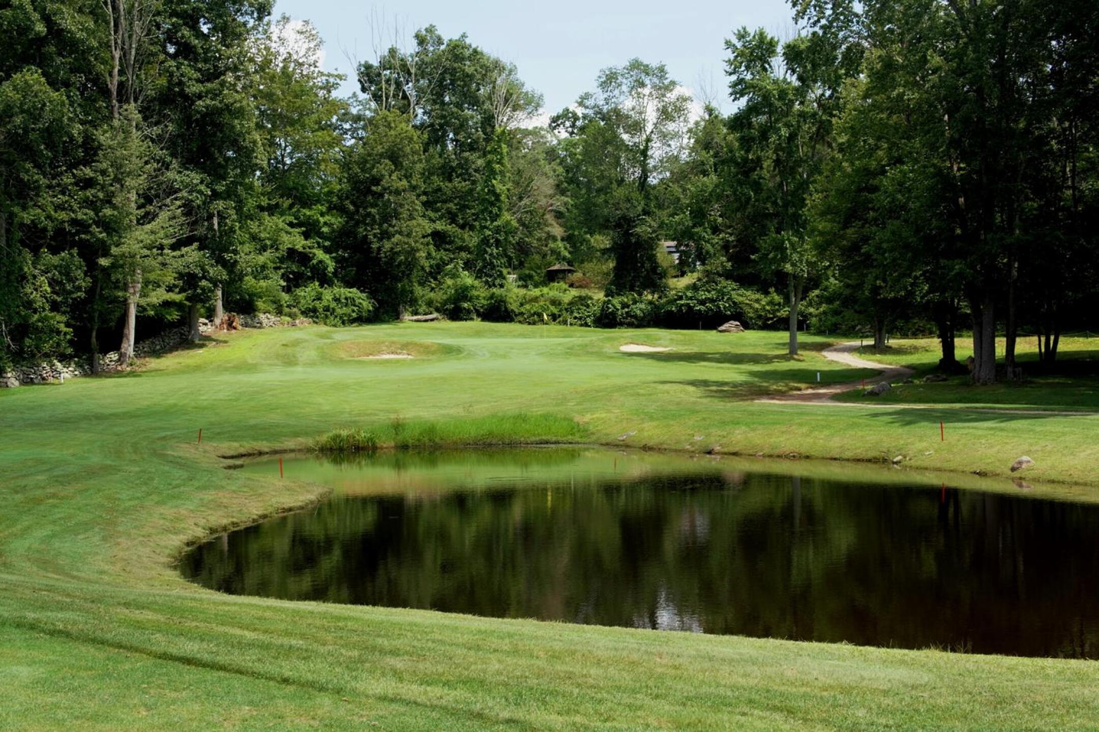 The seventh hole, a short par-4, features a pond placed to gulp down golf balls. (Photo submitted by AptlyLinked on 08/03/2023)