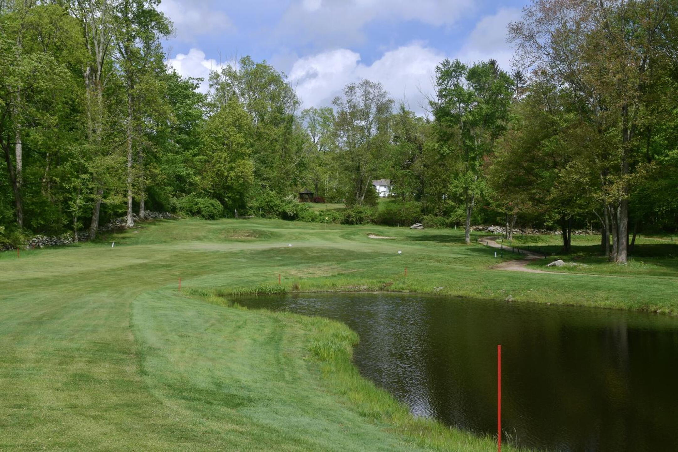 A hole with plenty of trees, the par-5 seventh throws in a pond and some greenside pot bunkers for good measure. (Photo submitted by AptlyLinked on 05/21/2025)