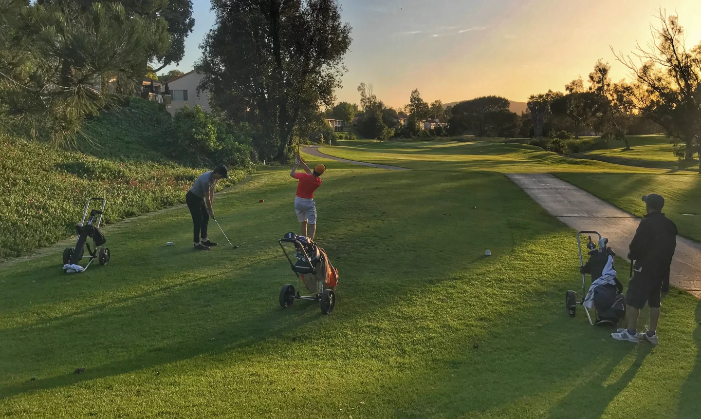 Golfers at sunset