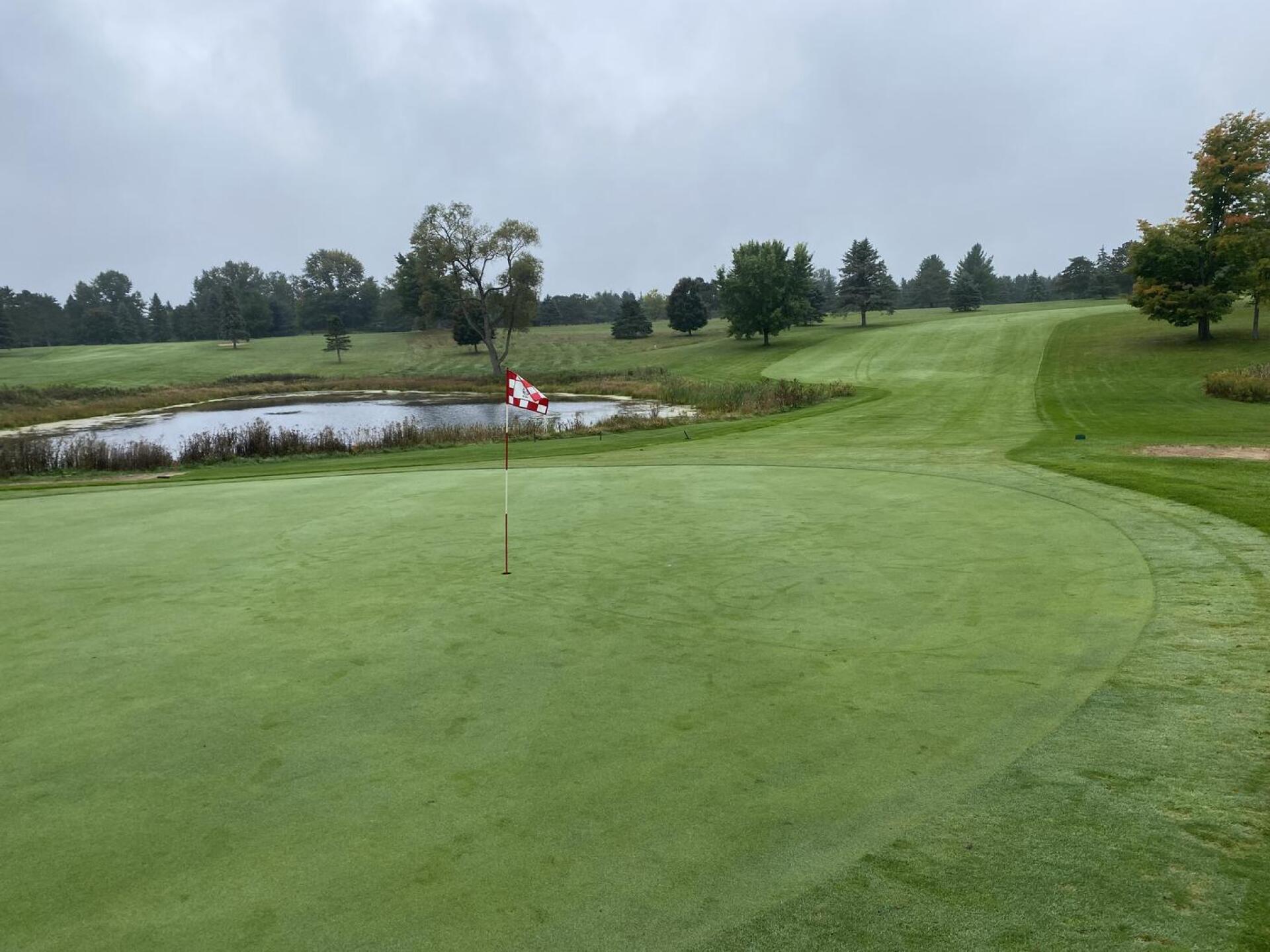 9th green. The toughest par four on the course after hole 5.  Again, you have to hit your tee shot far enough to the corner but too far means you'll go through the fairway.  Green slopes SEVERELY from back left to front right. (Photo submitted by u314161955381 on 12/27/2022)