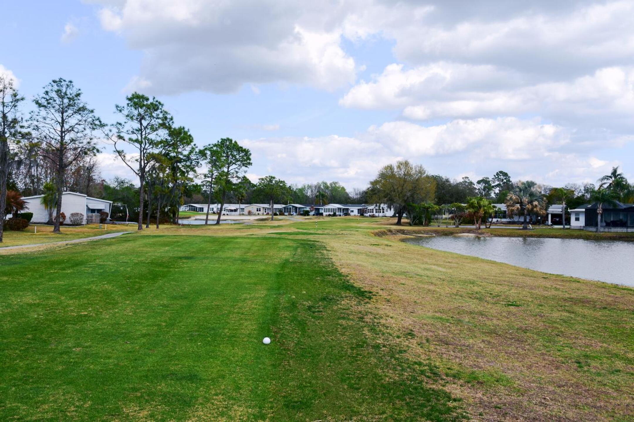 At the par-4 tenth, it takes a straight drive to find this narrow fairway. It’s not unusual, though, to find the water. (Photo submitted by AptlyLinked on 02/20/2026)