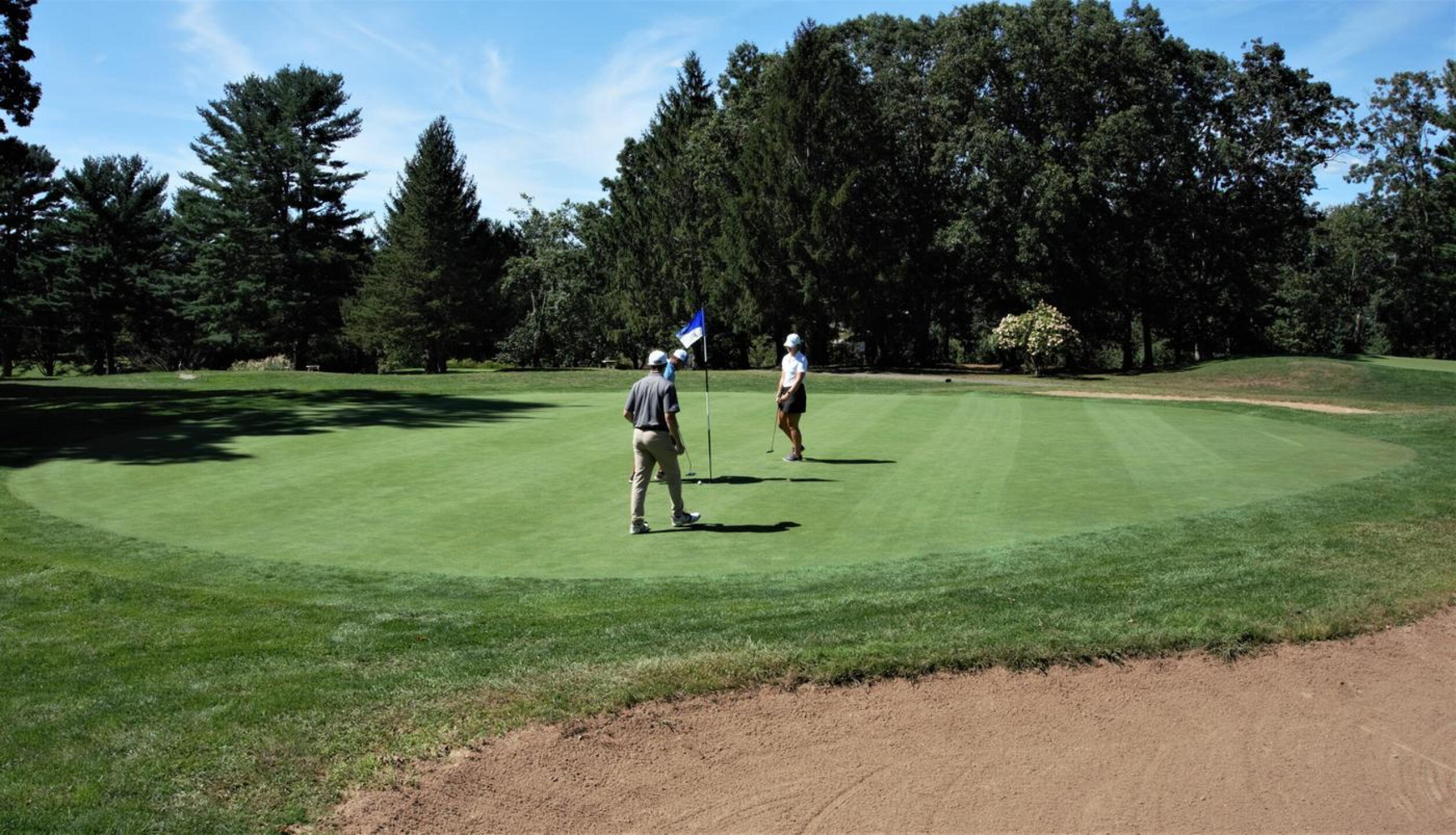 At the tenth, Nick, Chris (blue shirt), and Megan are finishing out on this tricky, short, uphill three-par. (Photo submitted by AptlyLinked on 09/16/2020)