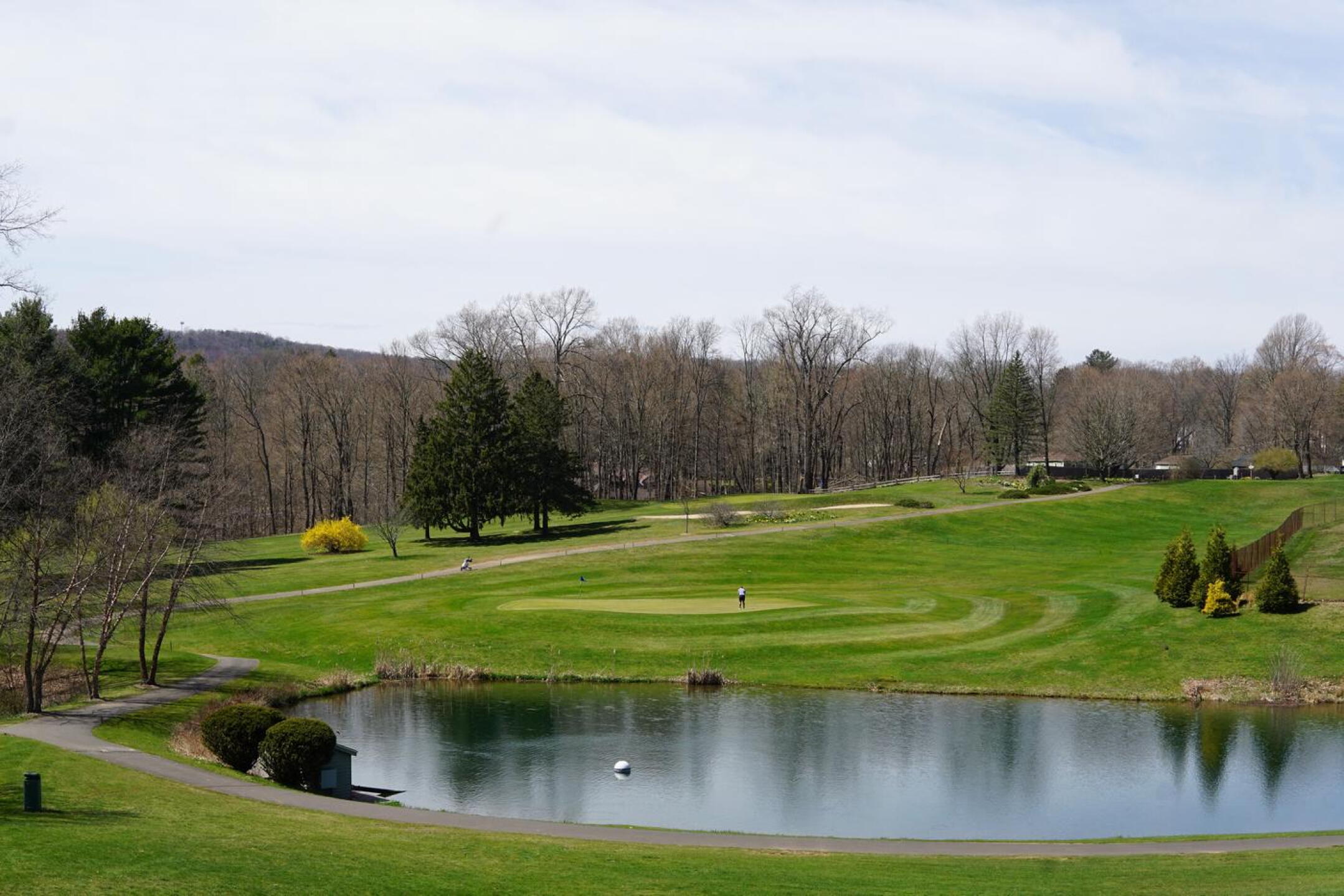 On the seventh green, a golfer putts over an undulating surface. (Photo submitted by AptlyLinked on 04/13/2023)