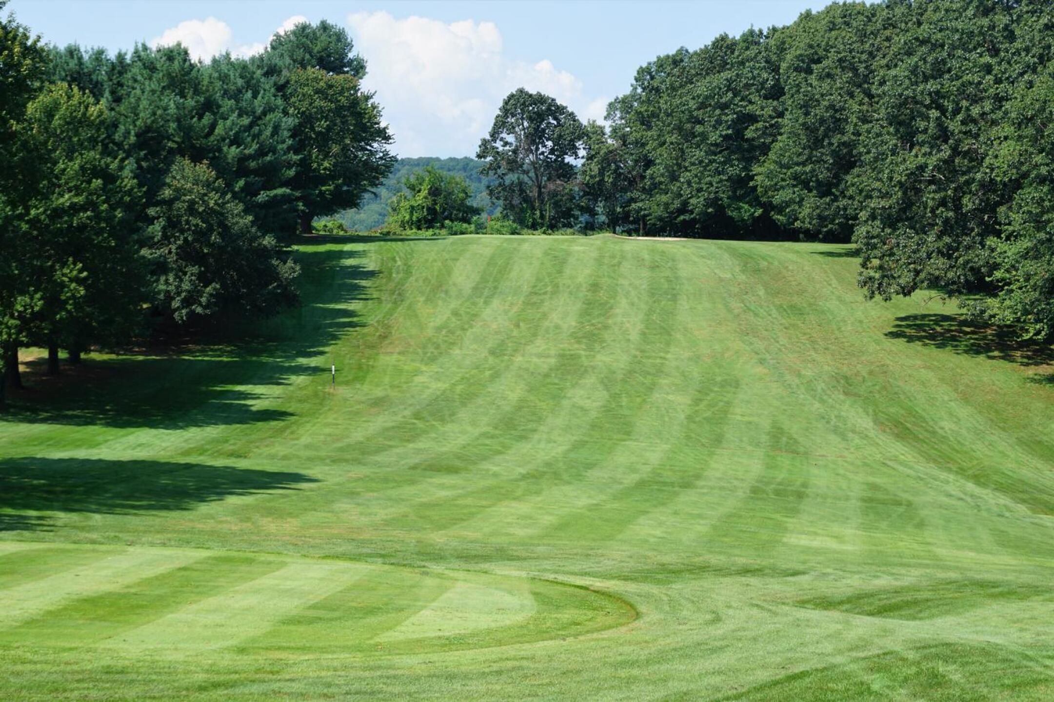 The tenth is a gorgeous par-5 that drops from a high tee to this fairway. The green sits atop the high plateau. (Photo submitted by AptlyLinked on 08/29/2021)