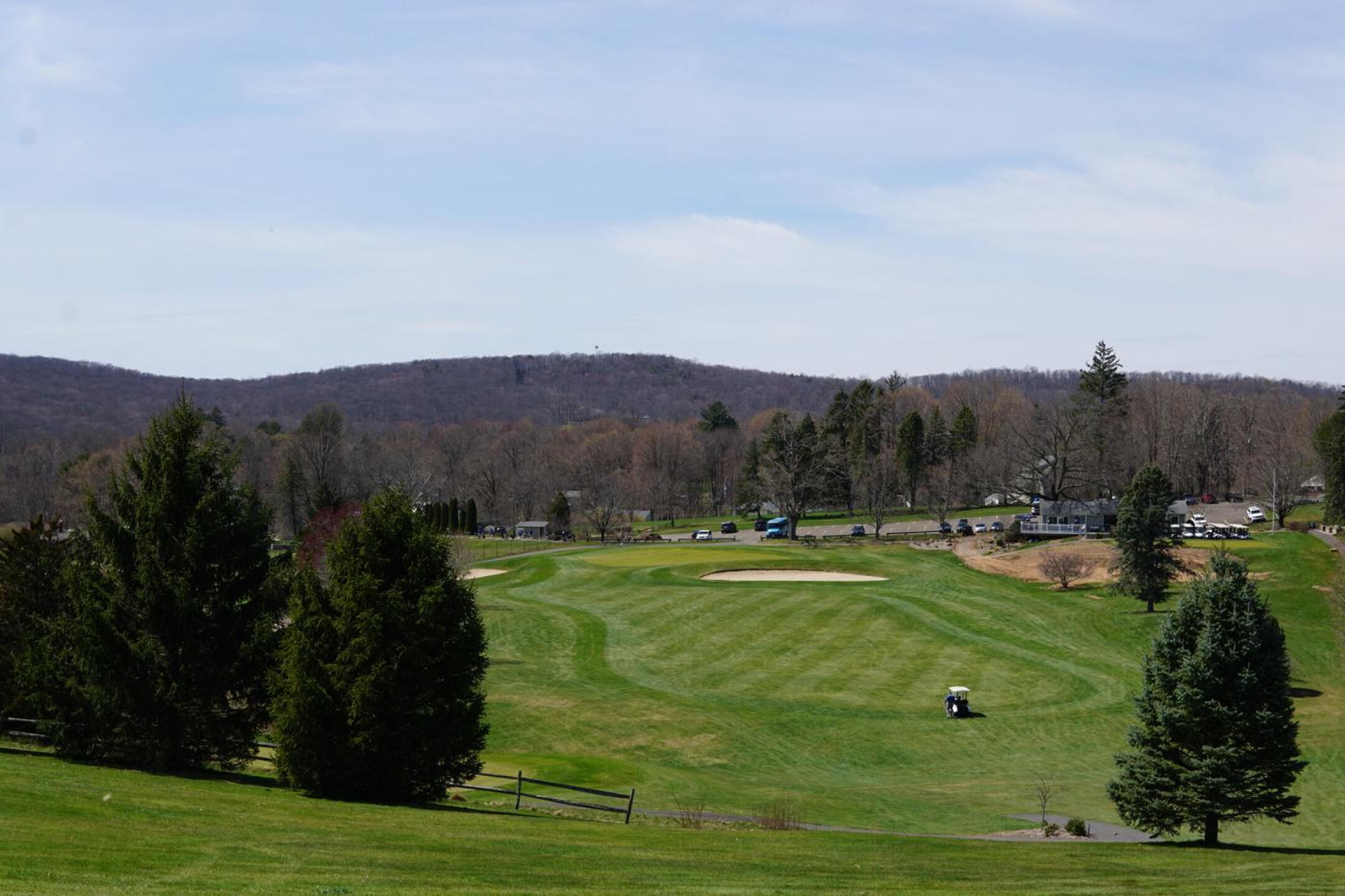 Nine is a drive-and-pitch hole ending on a raised green that is fronted by a massive bunker. (Photo submitted by AptlyLinked on 04/13/2023)