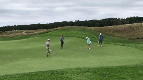Foursome on putting green