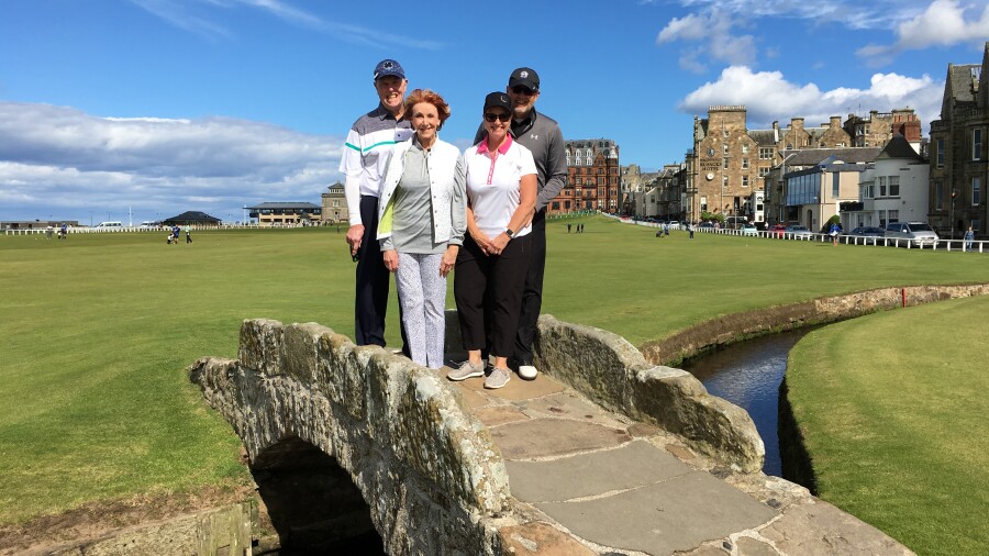 Two golf couples on the Swilcan Bridge