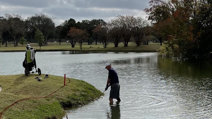 Jersey Meadow - golfer standing in water 