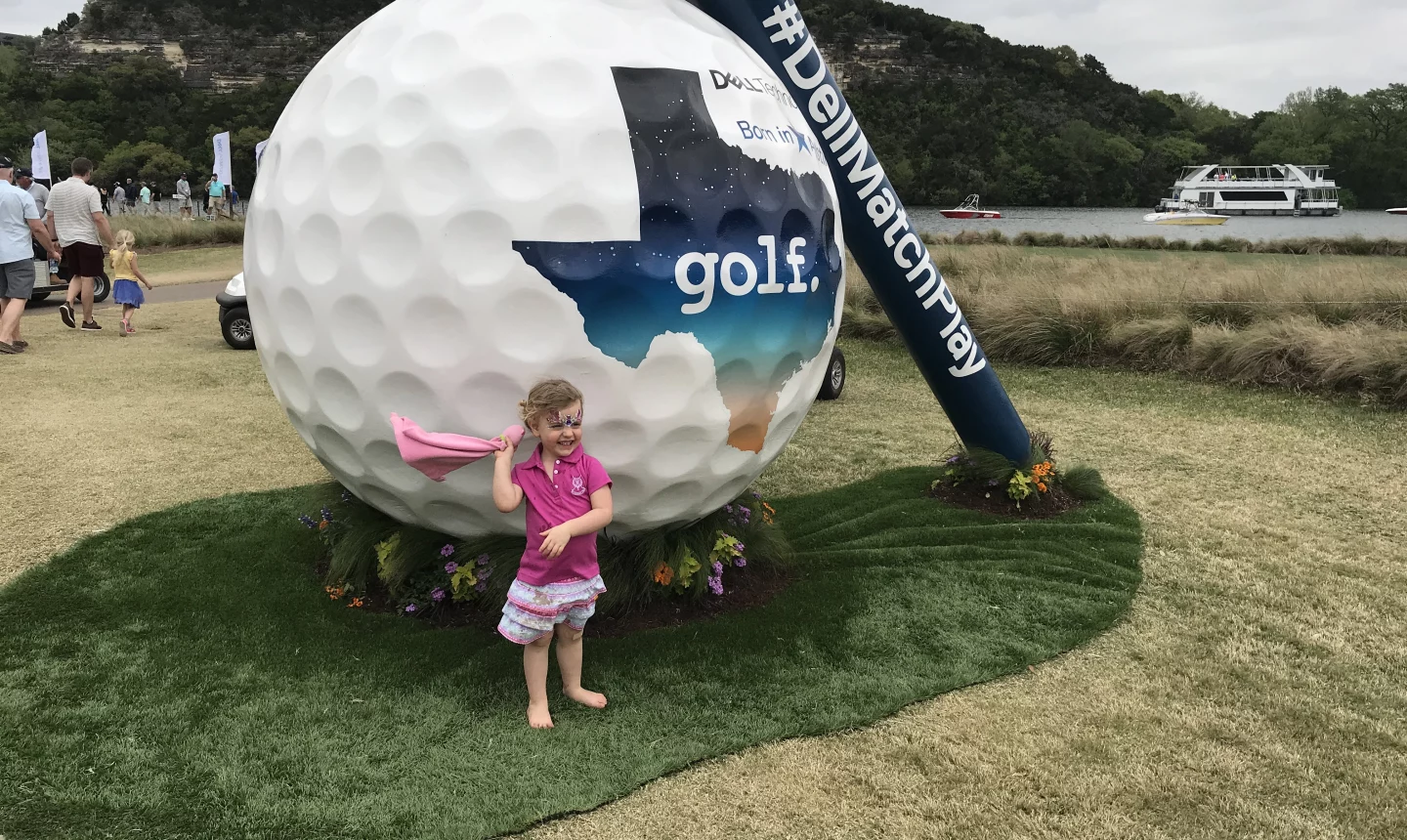 Child at pro golf tournament