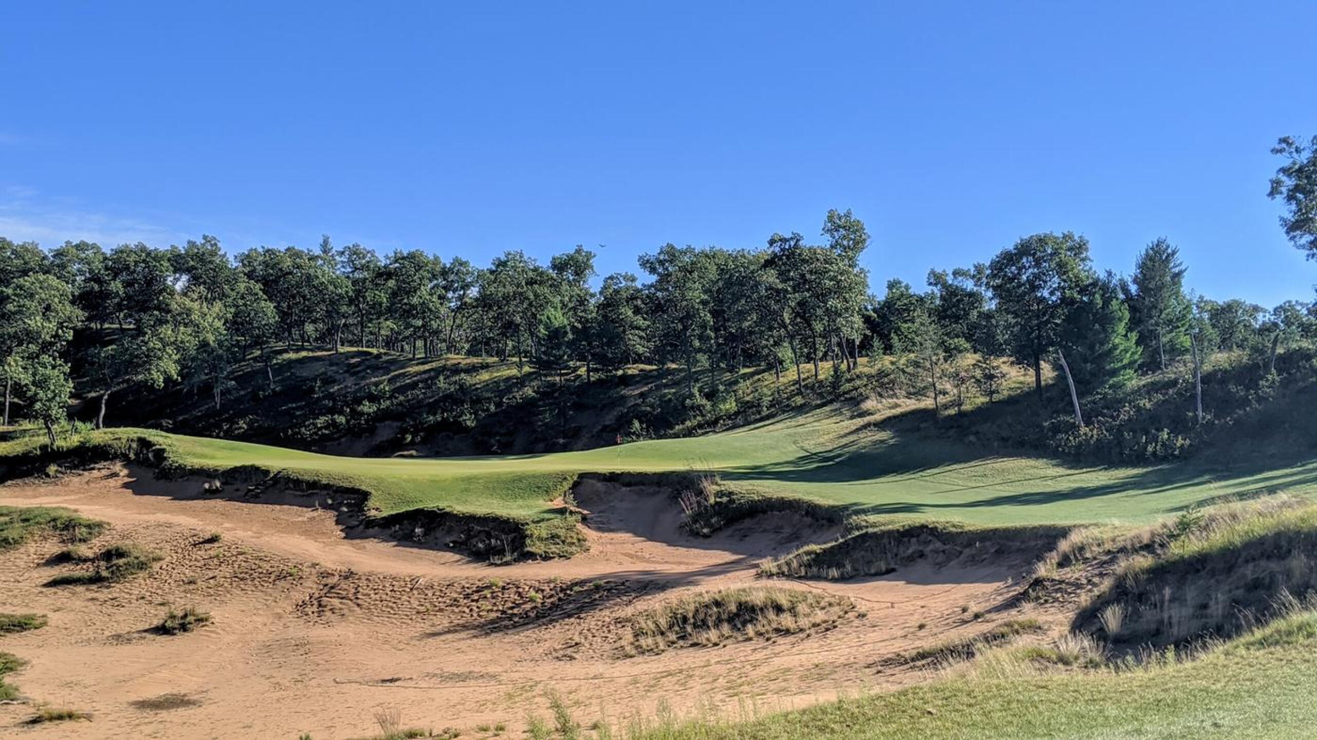 The par-3 13th is a thing of incredible beauty and challenge. (Photo submitted by Back9Ben on 09/24/2020)