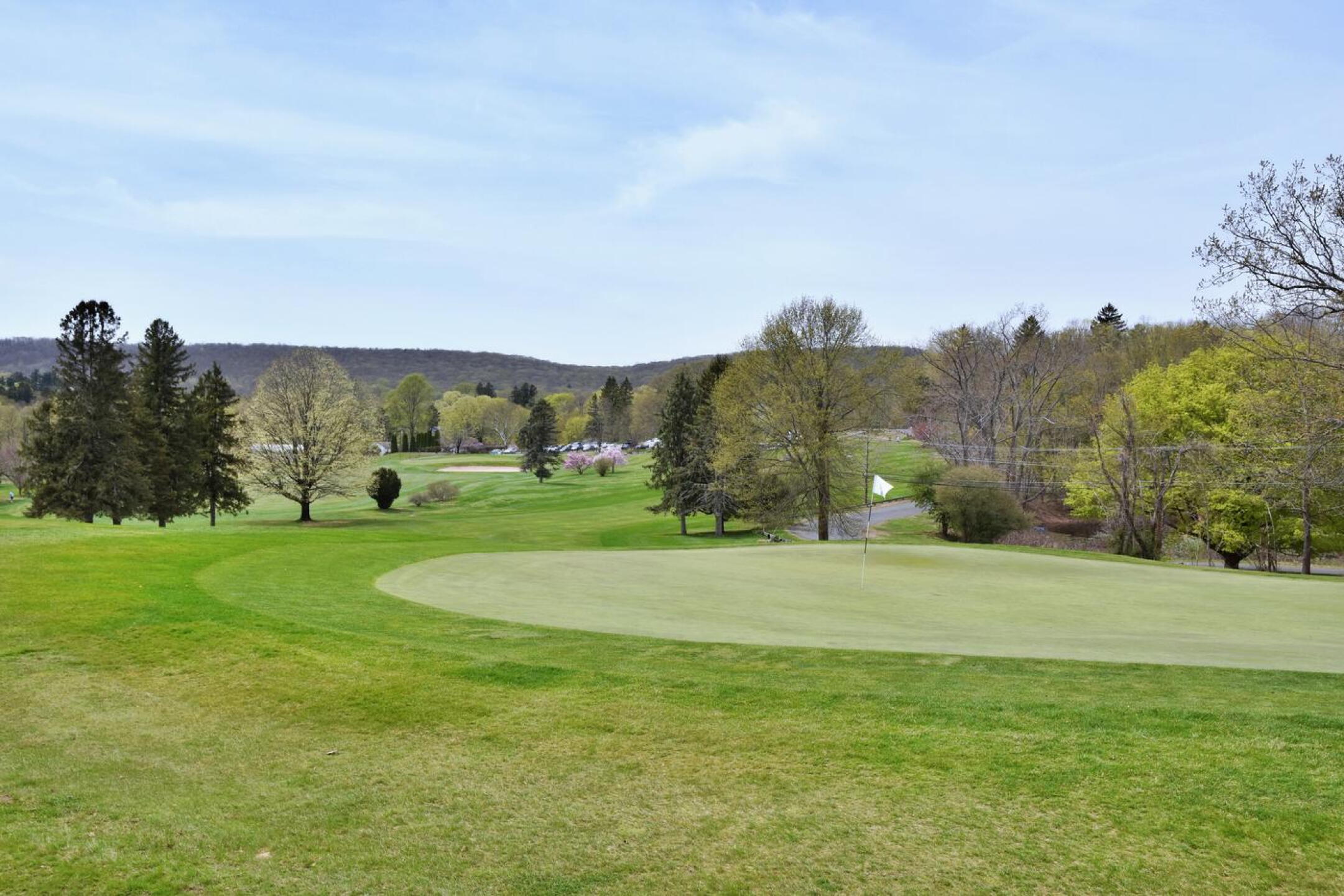 1st Hole (par-4, 336): From behind the green on a spring afternoon. (Photo submitted by AptlyLinked on 04/26/2025)