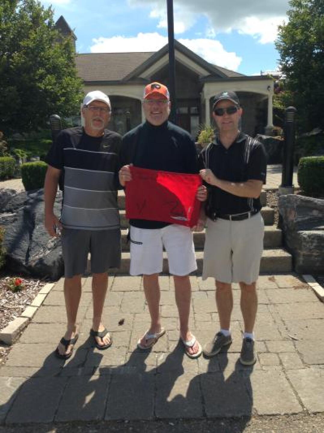 Me and the boys with flag given for hole in one! (Photo submitted by uUBOL7988UB on 08/21/2013)
