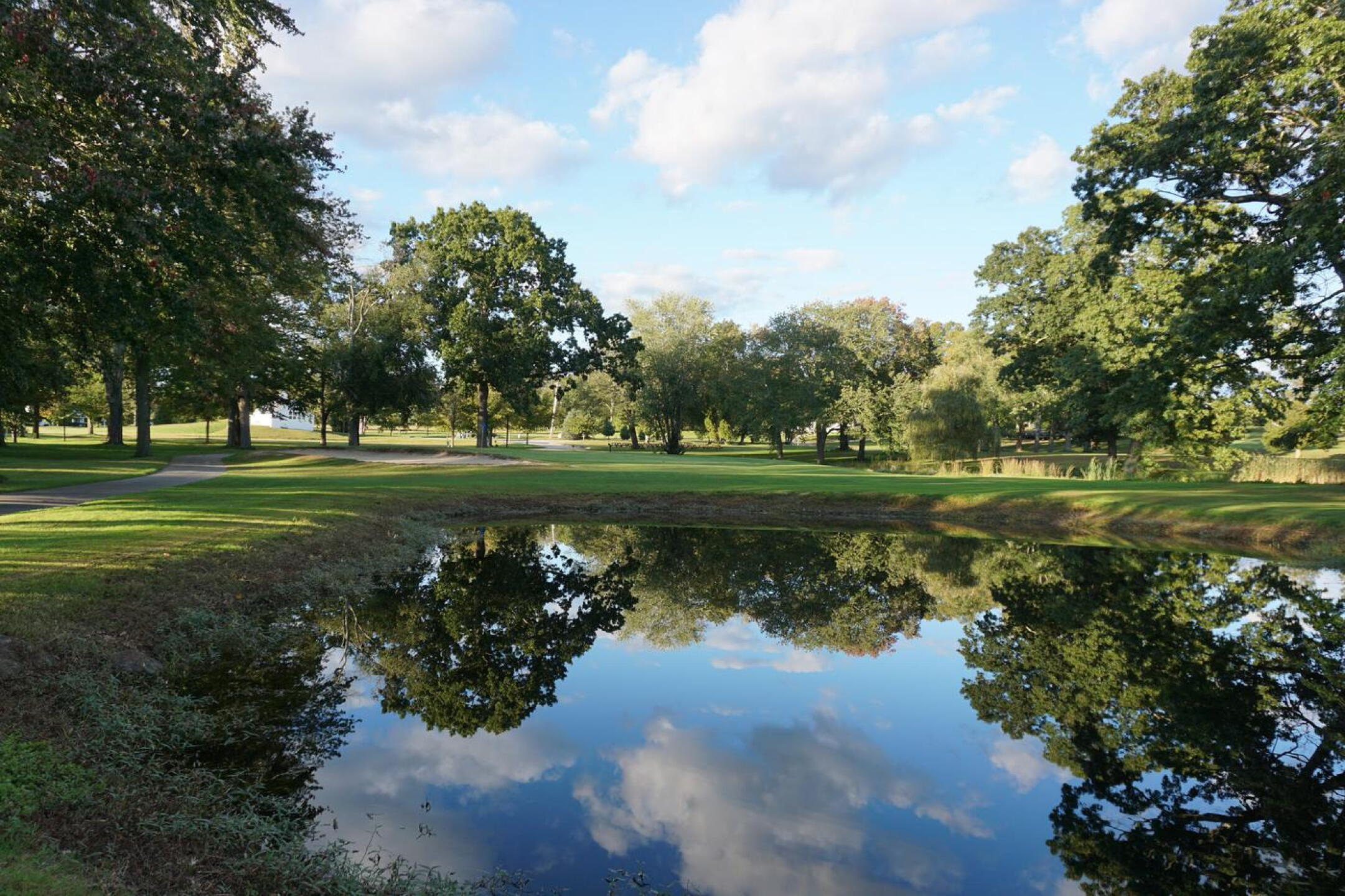 The eighteenth. I reflected on my rounds here this week walking up eighteen. The pond was equally reflective. (Photo submitted by AptlyLinked on 10/03/2021)
