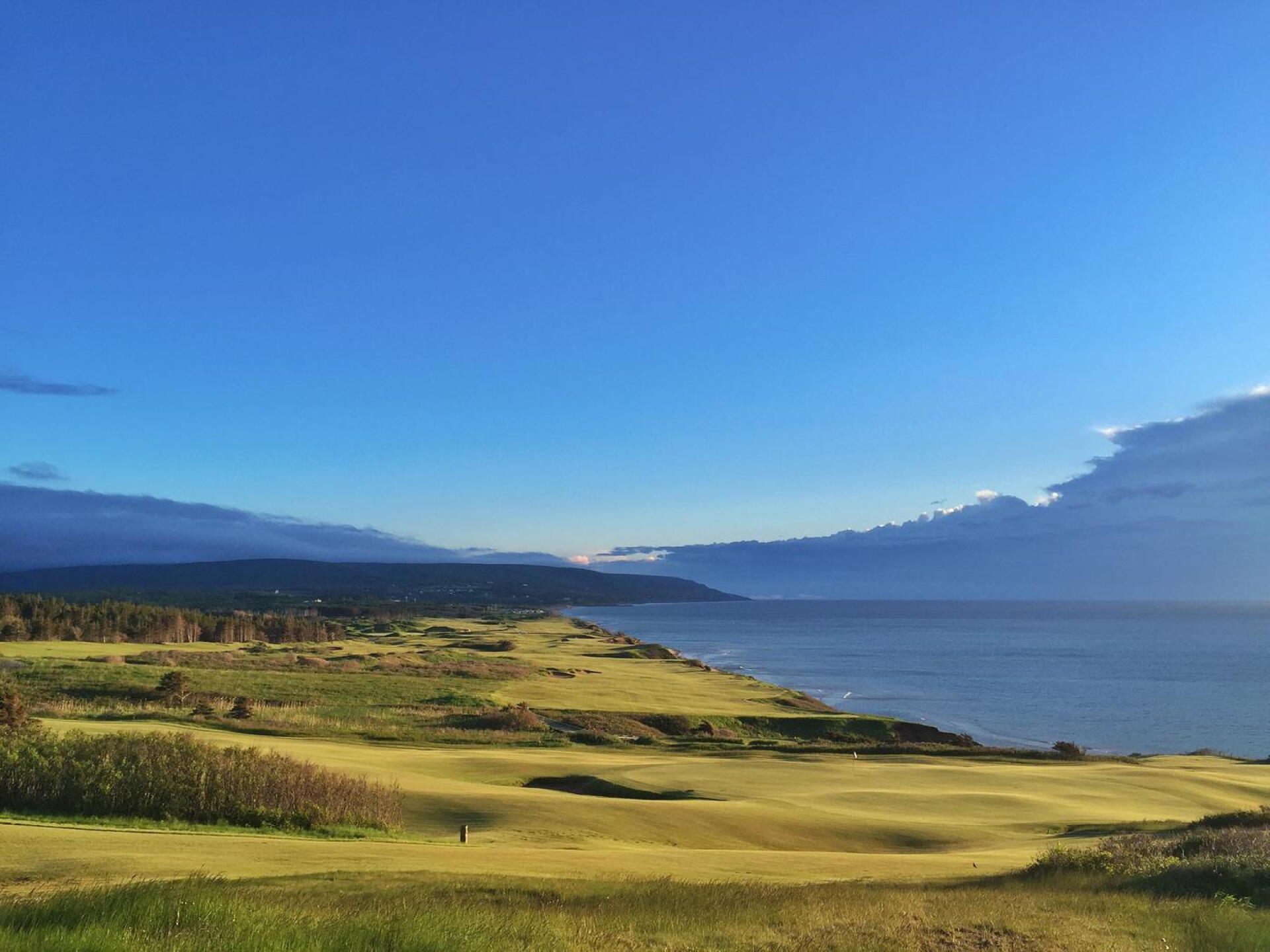 Looking beyond the 12th green and down the Canadian coastline. (Photo submitted by MattGinellaGA on 06/22/2016)