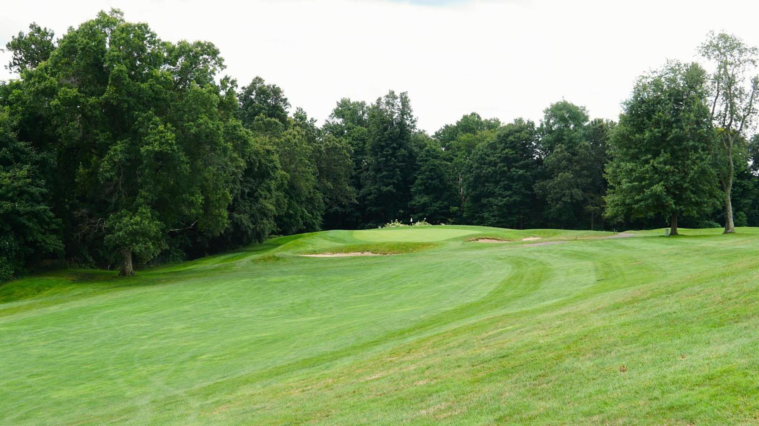 Protecting the par-5 second hole are some large greenside traps. The woods on the left can be a permanent habitation for golf balls. (Photo submitted by AptlyLinked on 08/20/2024)