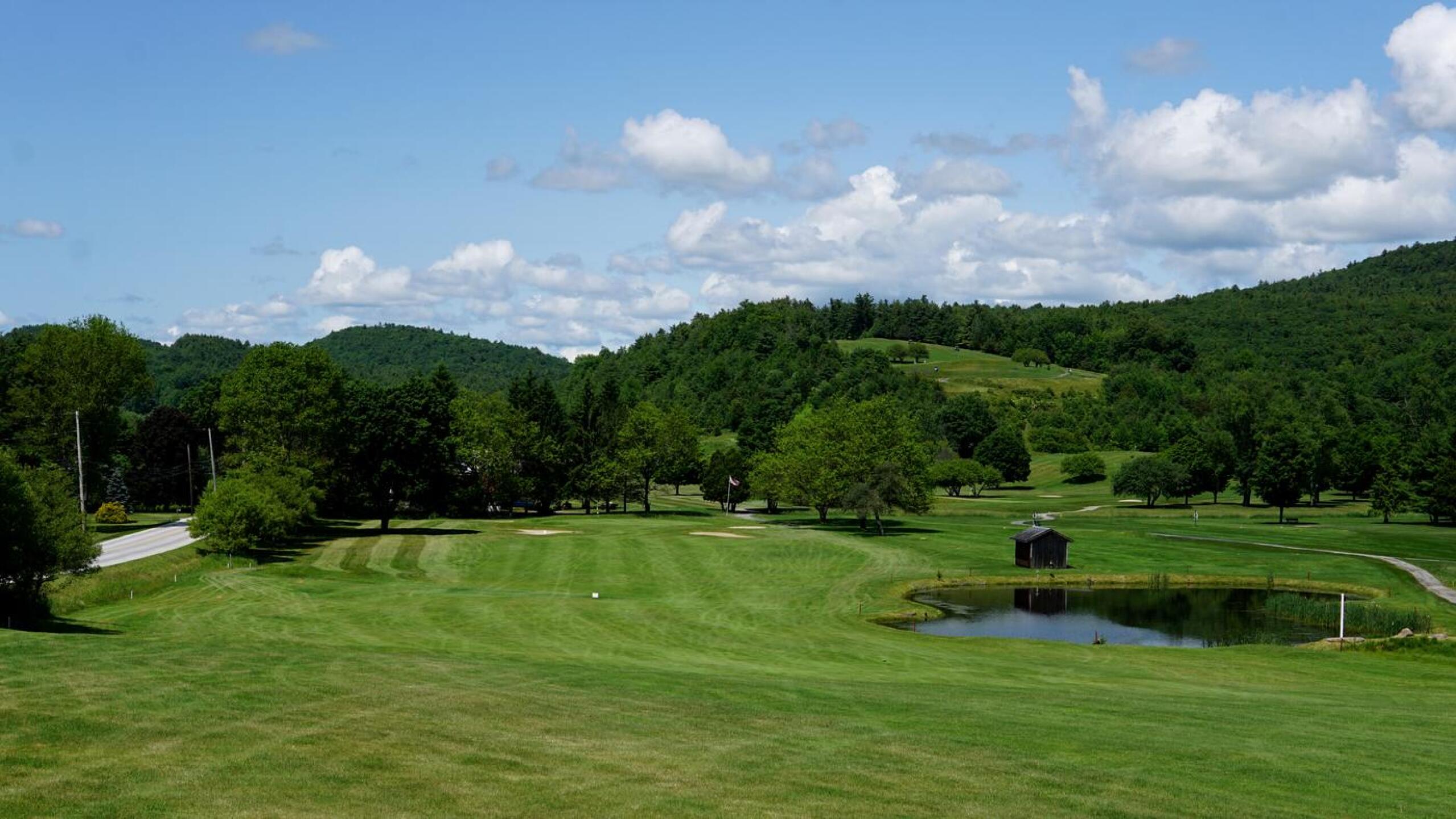 The par-5 tenth poses a difficult second shot with a fairway that lies between the road, left, and pond, right. (Photo submitted by AptlyLinked on 06/21/2023)