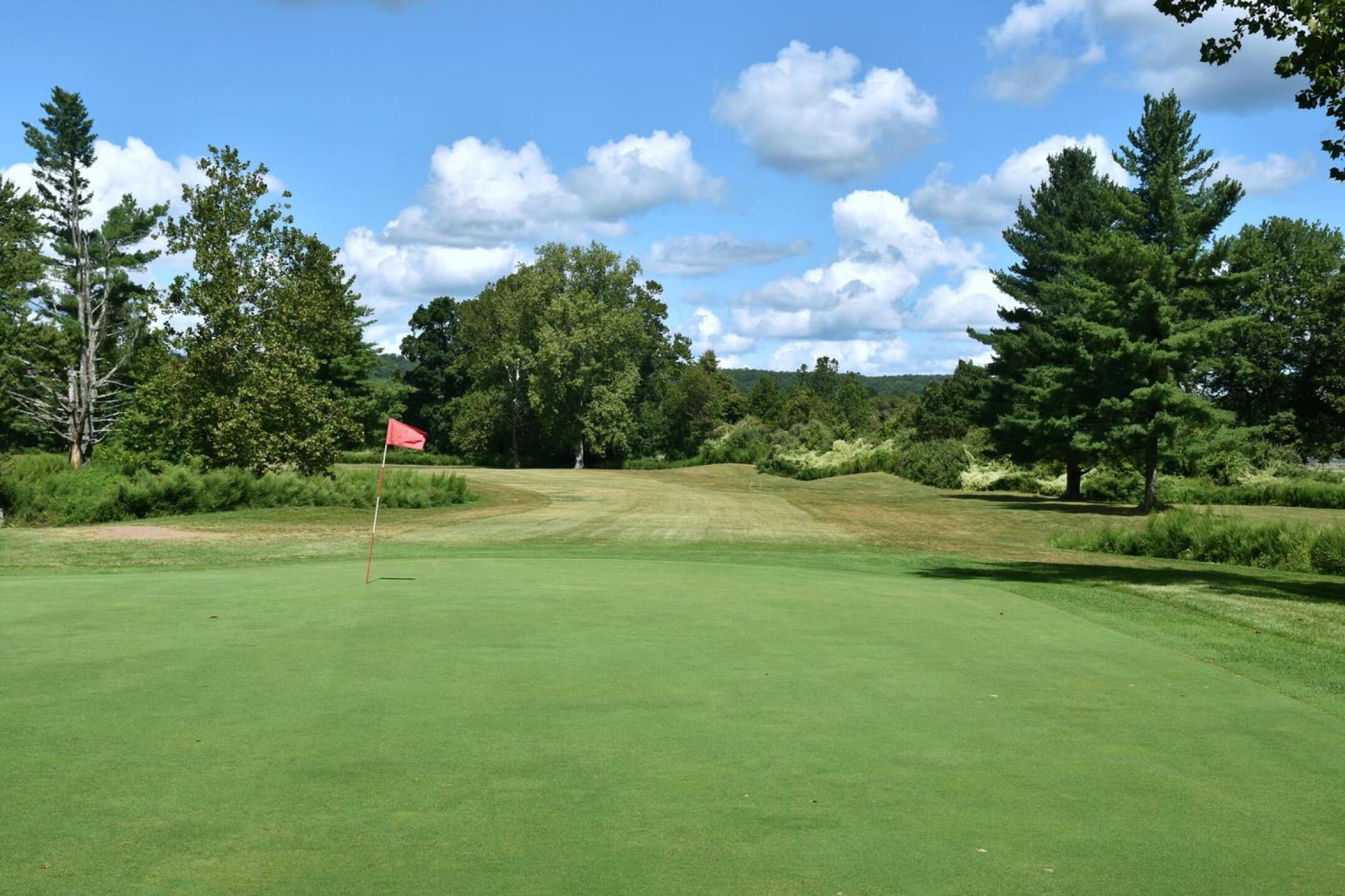 7th: This par-4/5 hole is one of the toughest at Pomperaug. Its fairway curves from left to right around a long water hazard to the right, out of bounds left. (Photo submitted by AptlyLinked on 08/28/2025)