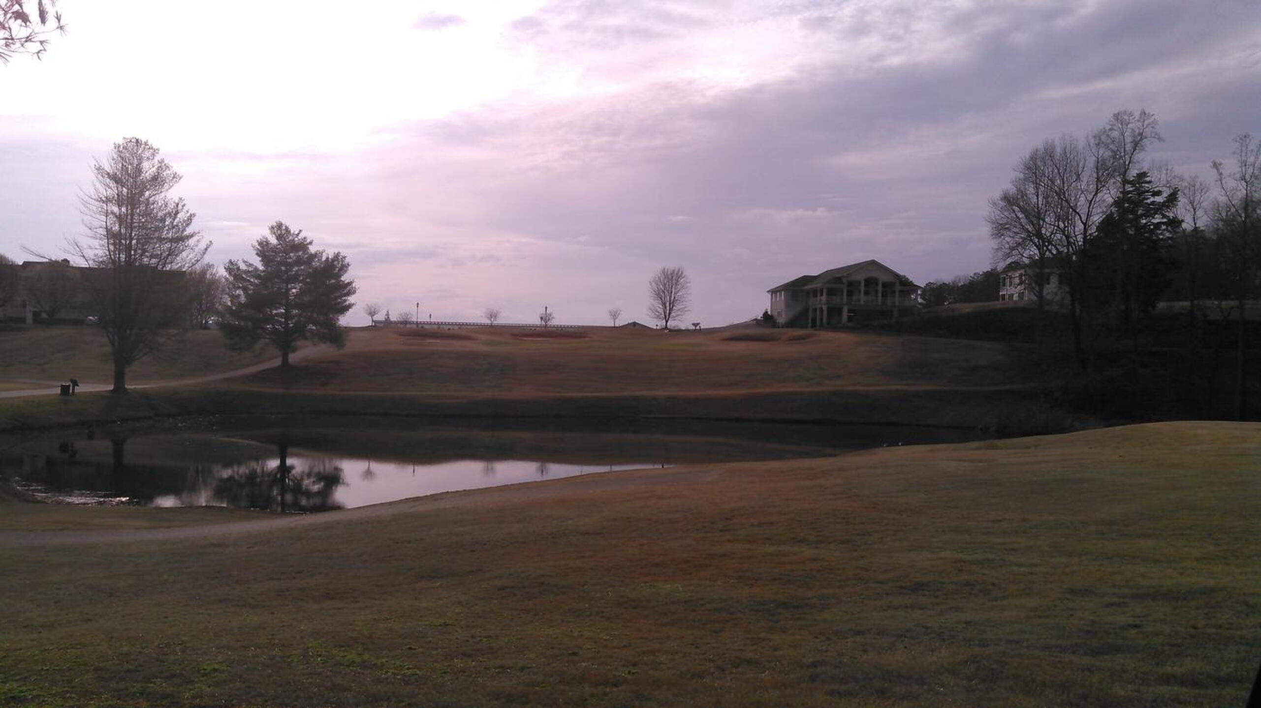 View of the 18th green and clubhouse from the layup area. (Photo submitted by vincedaddy on 02/23/2017)