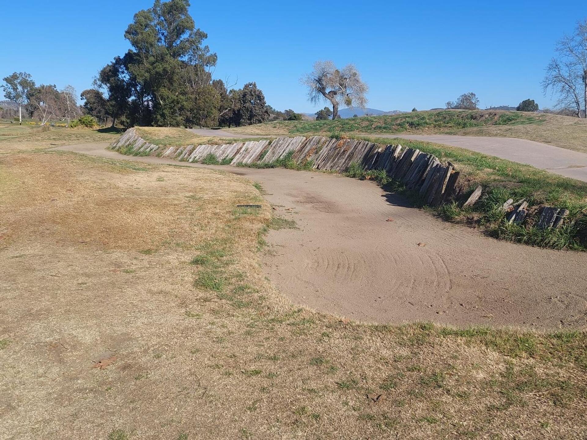 Sandless bunker showing maintenance neglect. This is on the 9th hole drive landing area. (Photo submitted by sherpaboy on 02/12/2022)