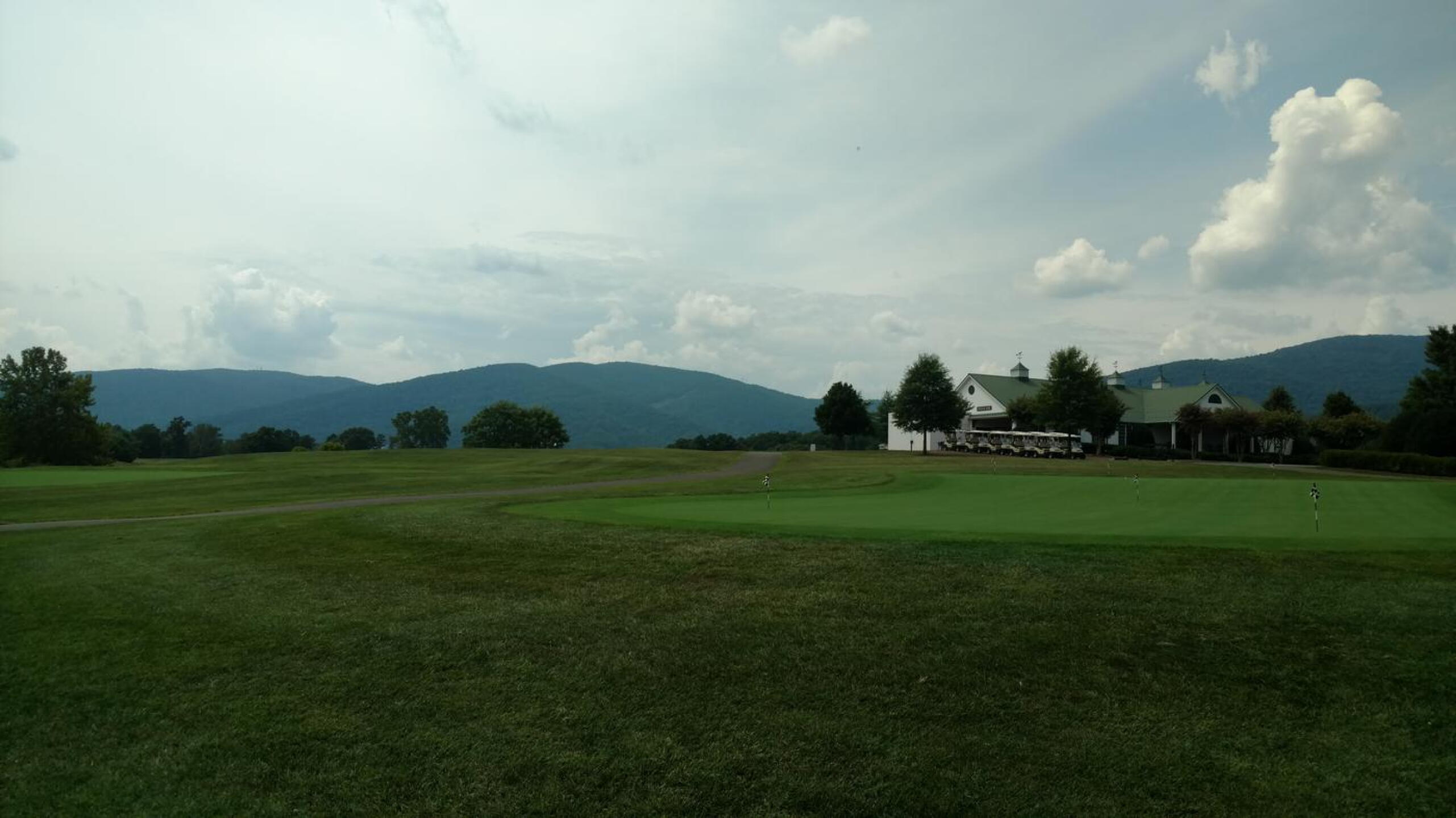 Overlooking the putting green and clubhouse with the Blue Ridge Mtns as the backdrop (Photo submitted by Back9Ben on 08/01/2017)