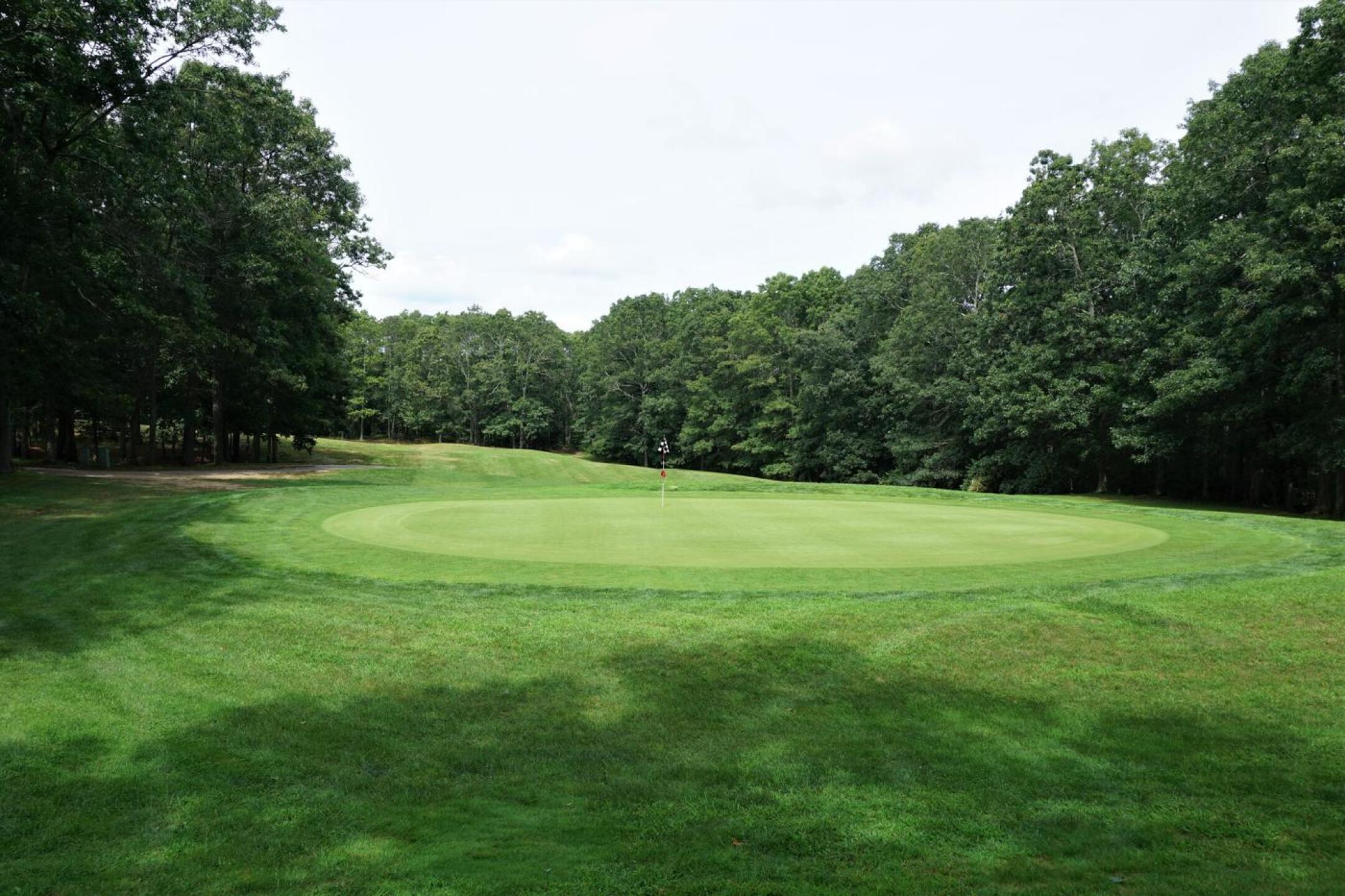 The sixth hole at the White, a hard dogleg right, demands a tough uphill second shot to this plateau green. (Photo submitted by AptlyLinked on 08/19/2021)