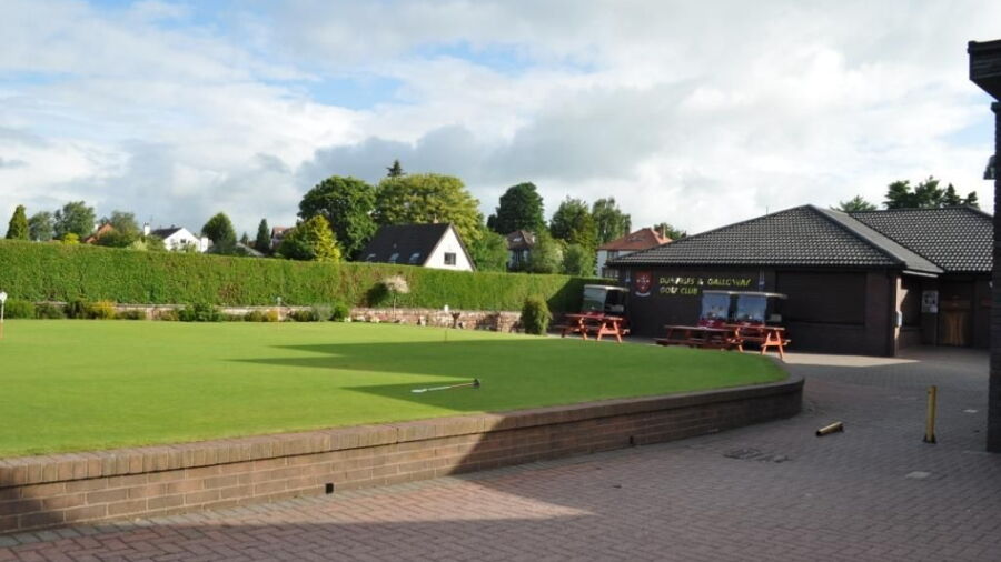 The clubhouse and putting green at Dumfries & Galloway Golf Club