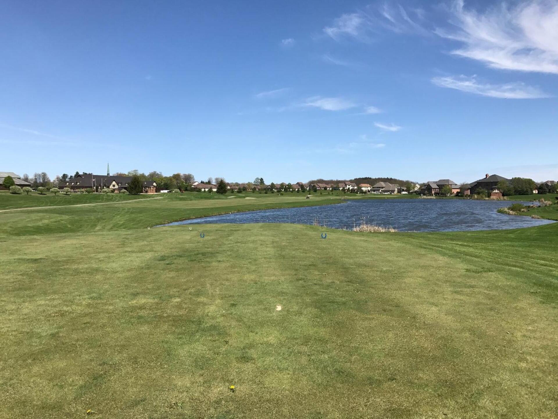 The par 4 18th, cape template, right to left, the water cuts back in close after the furthest point and it is possible to roll into the water for drives over 260 from blue tees. (Photo submitted by carolinadad on 04/25/2017)