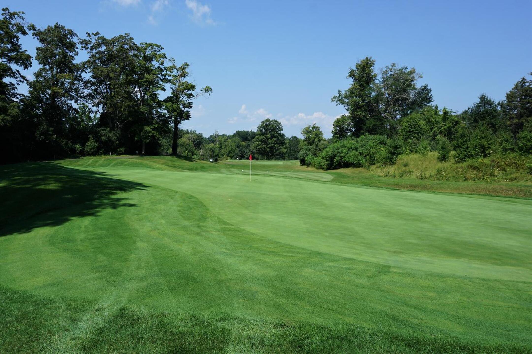 The sixth, 173, 3-par: The long slender green, obliquely set to the tee, is a common feature at Gillette. (Photo submitted by AptlyLinked on 08/28/2021)