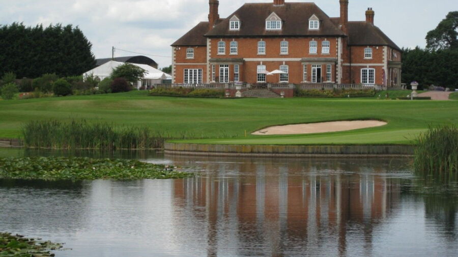 18th green and clubhouse at The Astbury