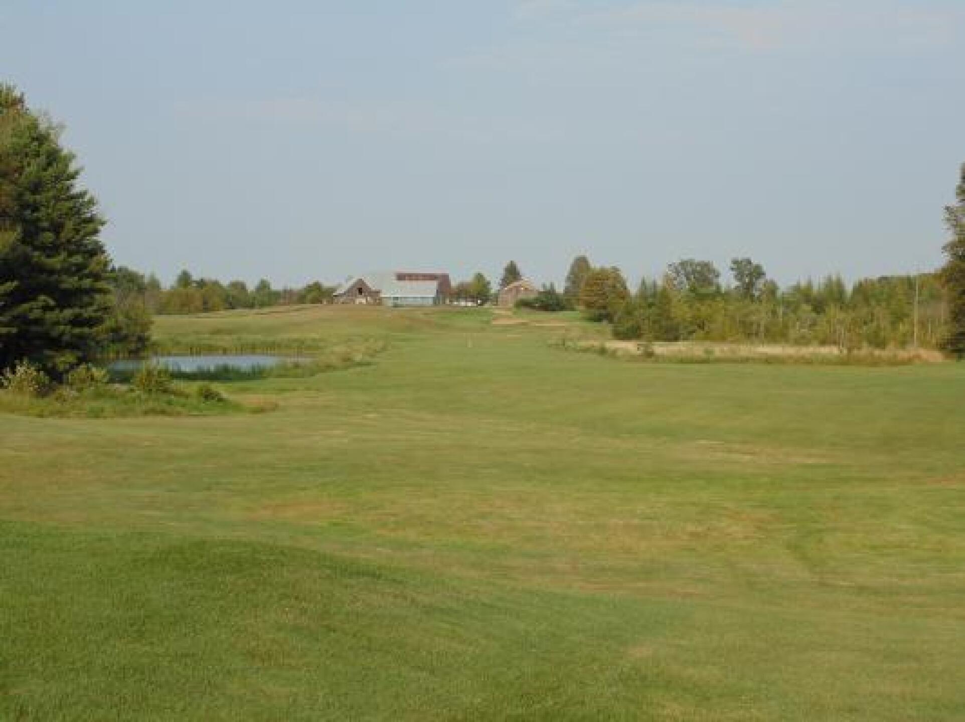 Intimidating 2nd shot (and approach if you can see all the bunkers) on 18. (Photo submitted by oiler3535 on 08/21/2013)
