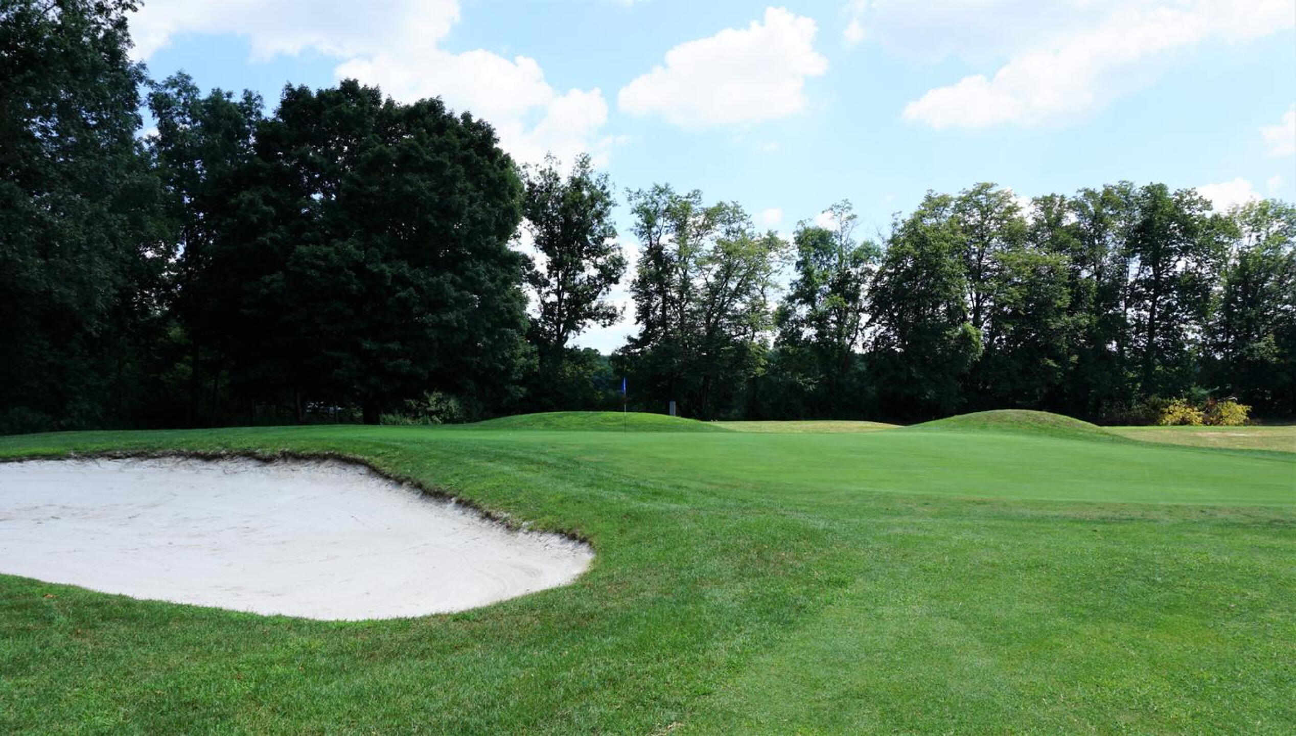 A big bunker guards the left front of green four, which is two-tiered. (Photo submitted by AptlyLinked on 08/11/2020)