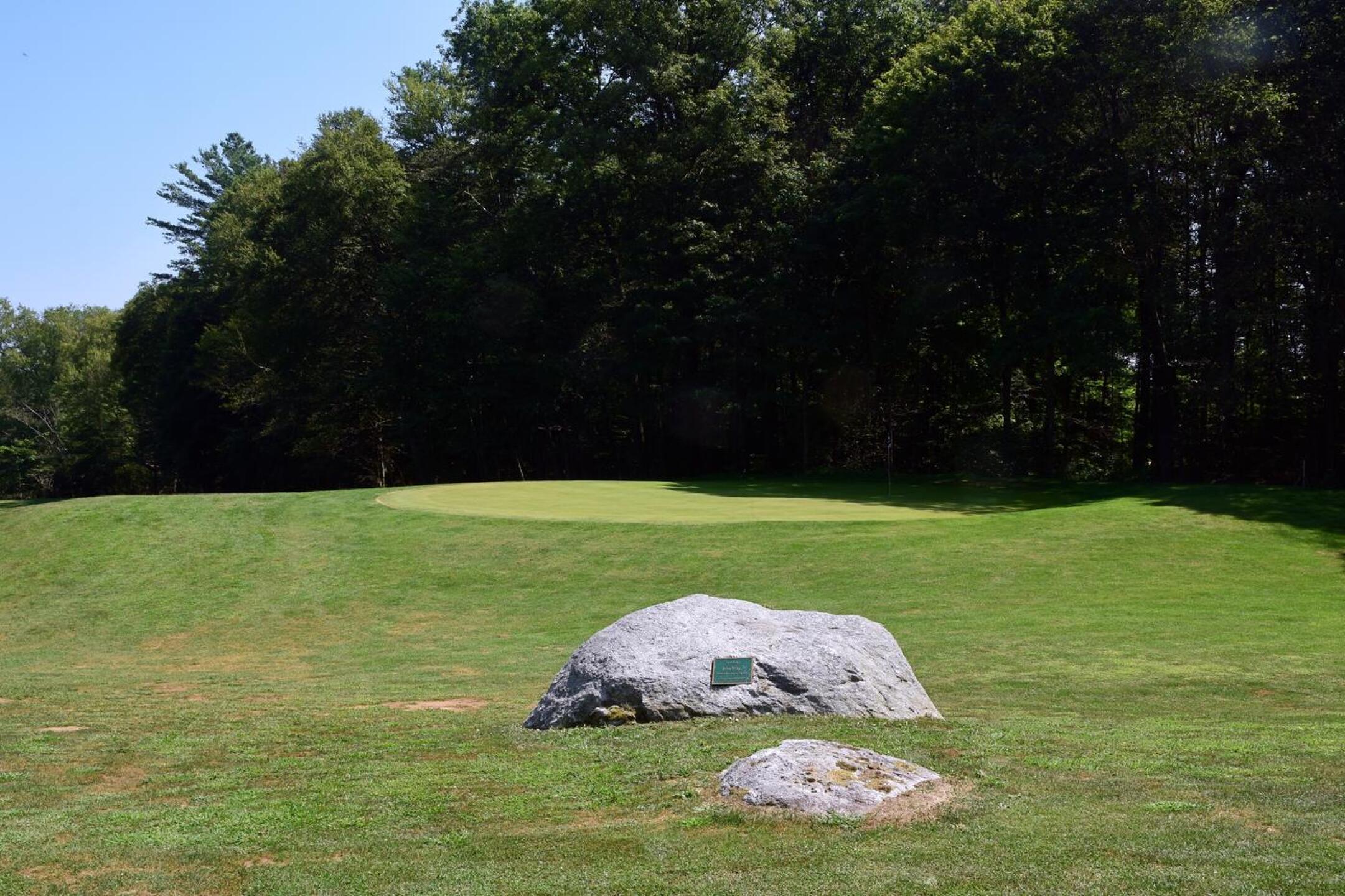 6th: At this short par-4, the memorial stone’s dedication is for a Mr. John Young, who is described as having been a “dedicated golfer and employee” of this golf course. (Photo submitted by AptlyLinked on 08/12/2025)