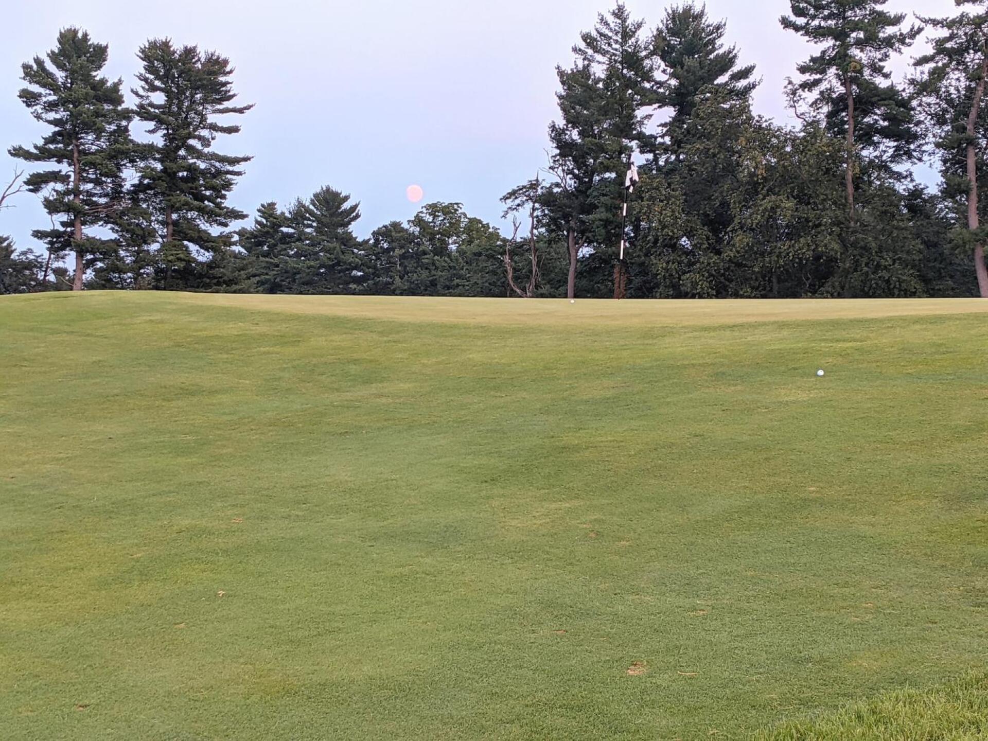 The 13th green at dusk with a full moon rising. (Photo submitted by GolferJake78 on 08/21/2021)