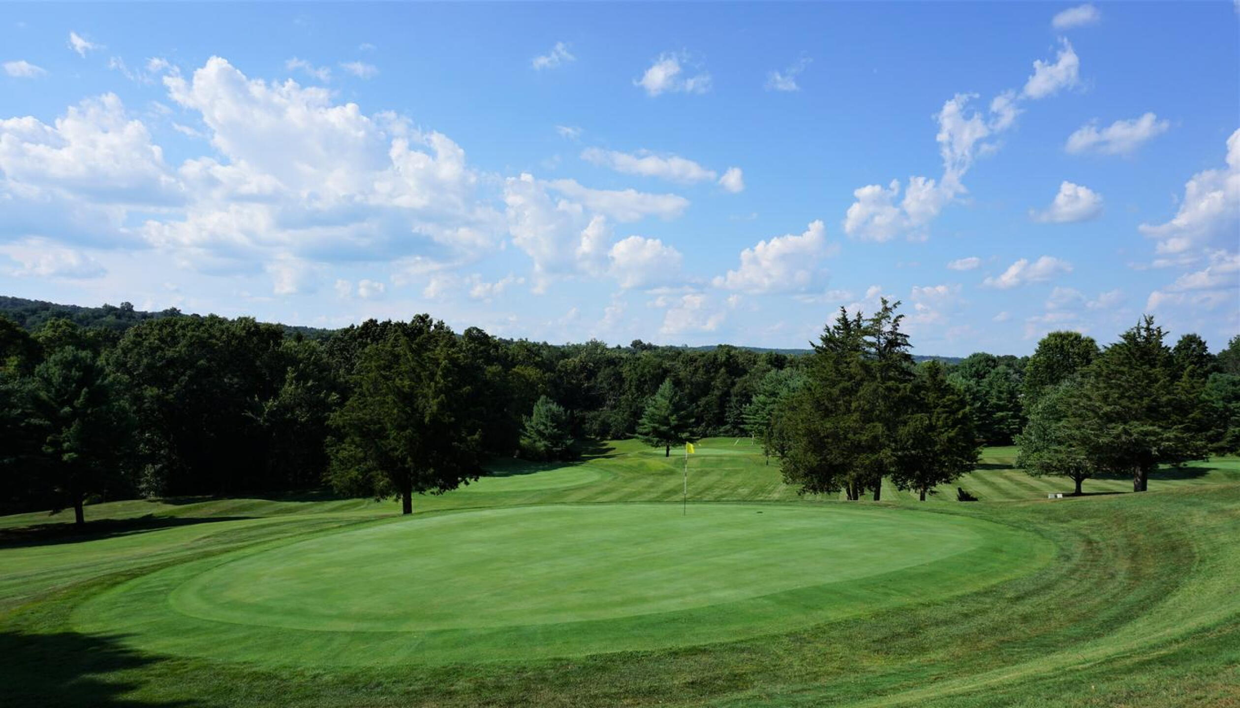 From behind the eighth green. This excellent hole travels straight up the hill from its tee. (Photo submitted by AptlyLinked on 08/13/2020)