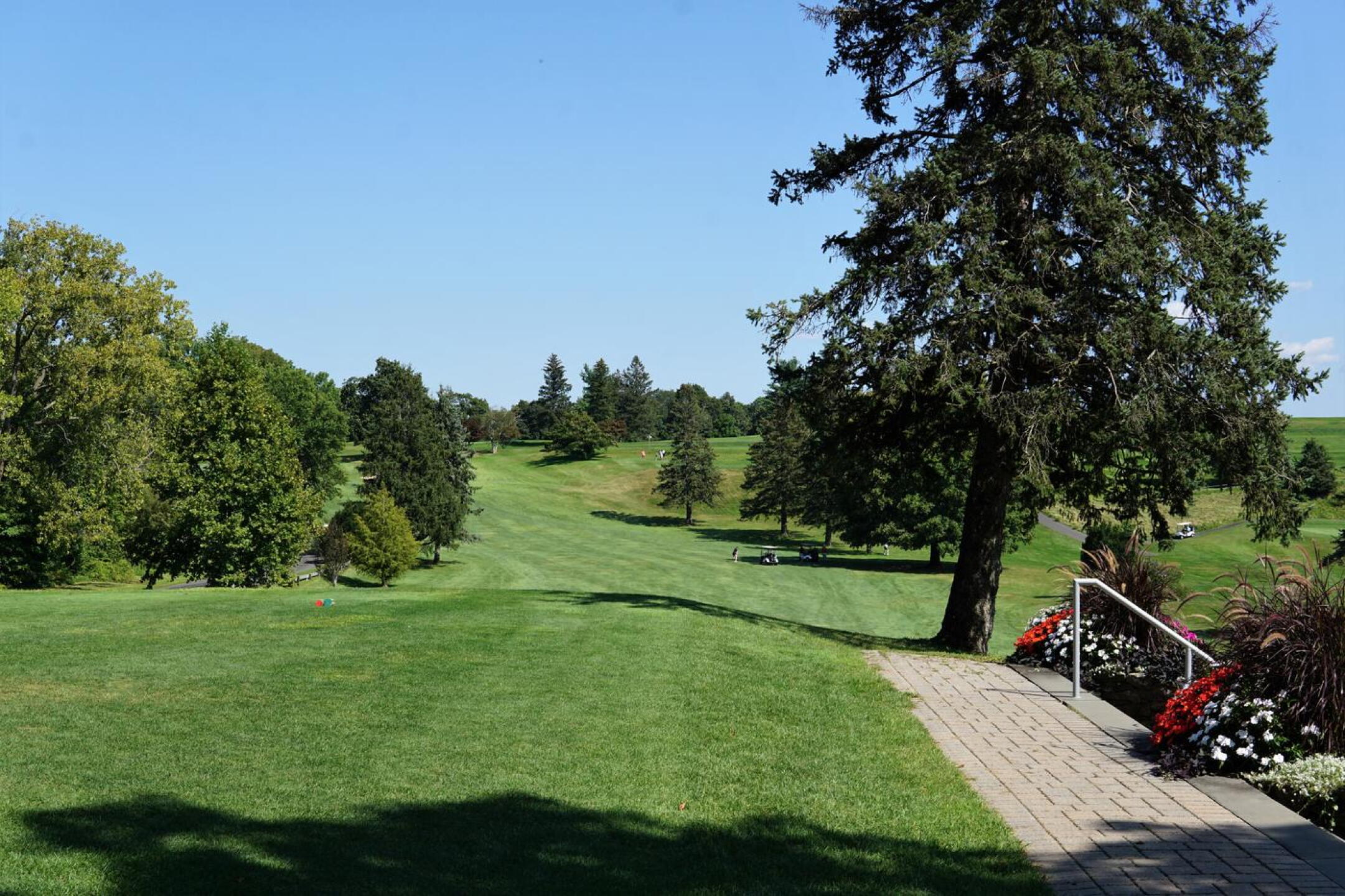 This view from the first tee at The Springs is pleasant, although a road lurks on the left side. (Photo submitted by AptlyLinked on 09/06/2023)